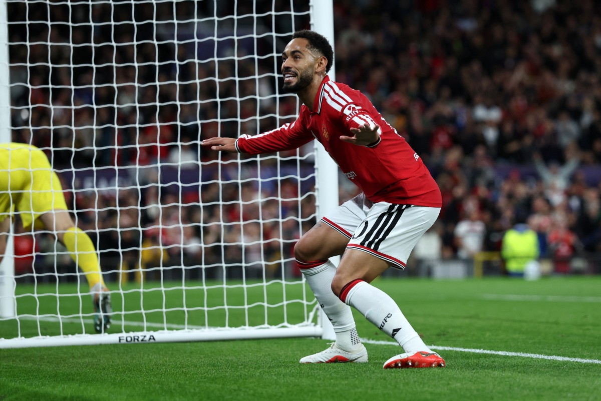Manchester United's Brazilian striker #10 Matheus Cunha celebrates scoring the team's first goal during the UEFA Champions League football match