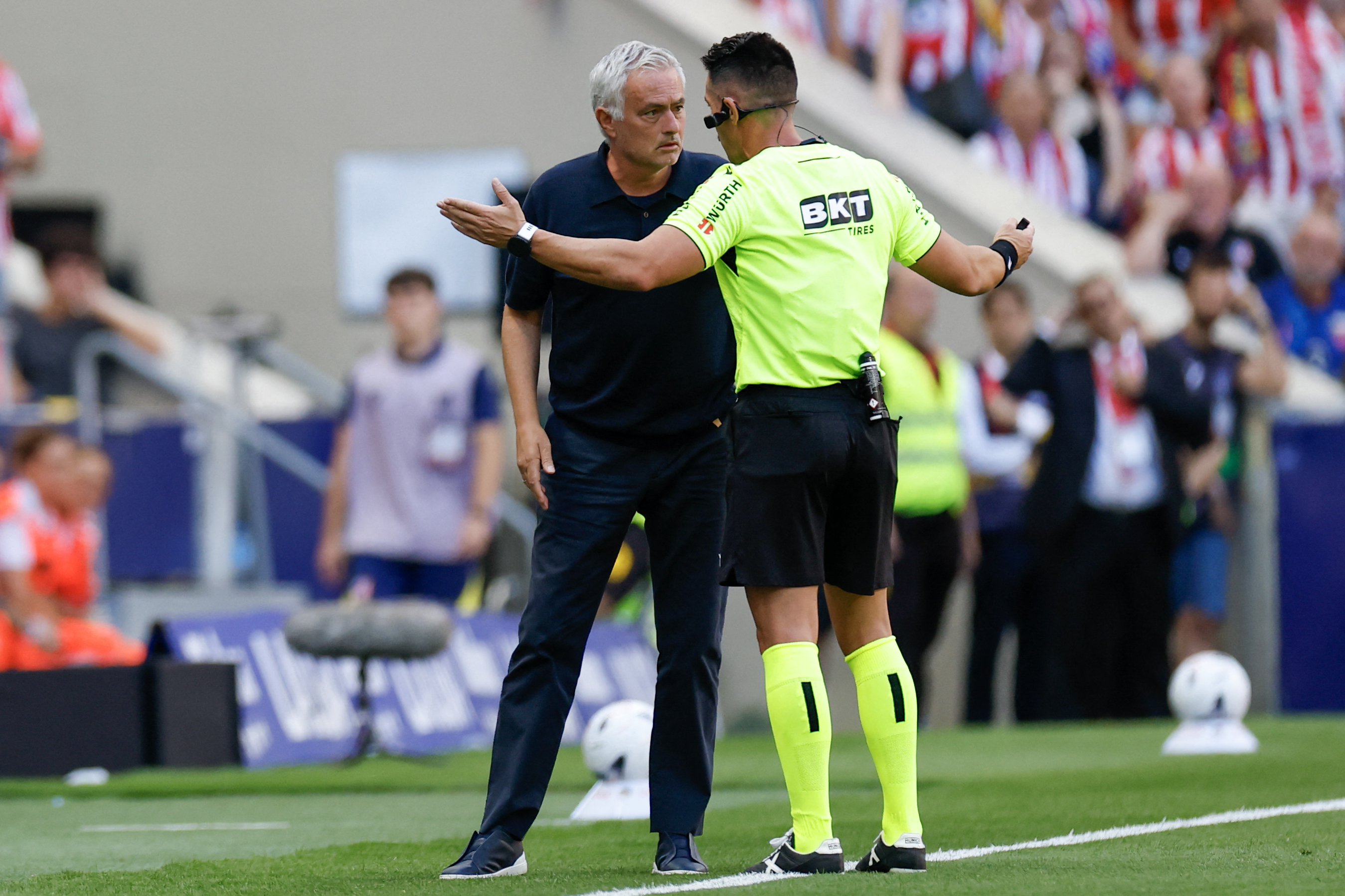 Referee Miguel Angel Ortiz Arias speaks to Real Madrid's Portuguese coach Jose Mourinho during the Spanish league football match between Club Atletico de Madrid and Real Madrid CF at the Metropolitano stadium in Madrid on September 20, 2026. (Photo by Oscar DEL POZO / AFP)