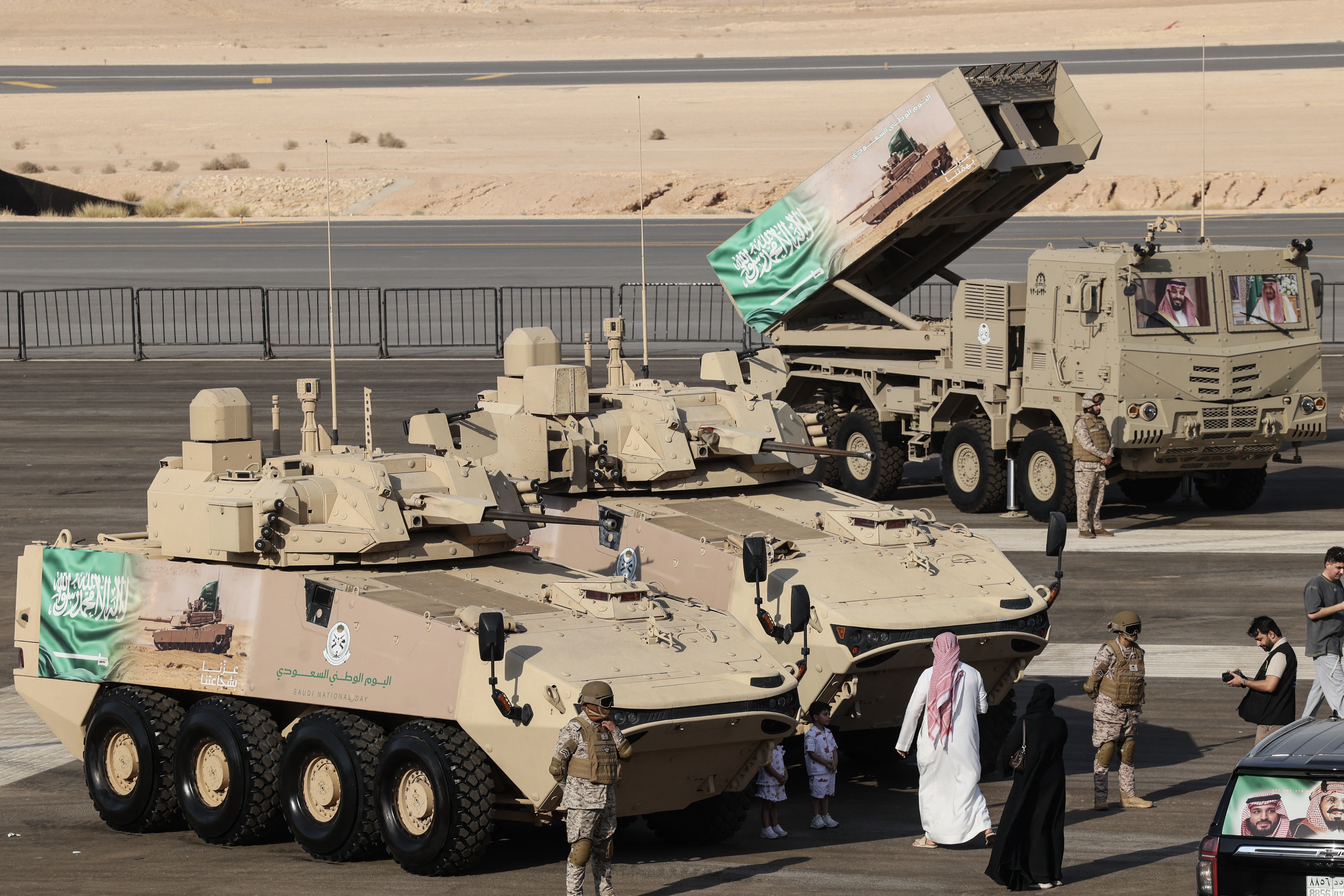 Saudis pose in front of LAV-FSV light armoured vehicles on display during a military parade marking the 96th Saudi National Day in Riyadh on September 22, 2026