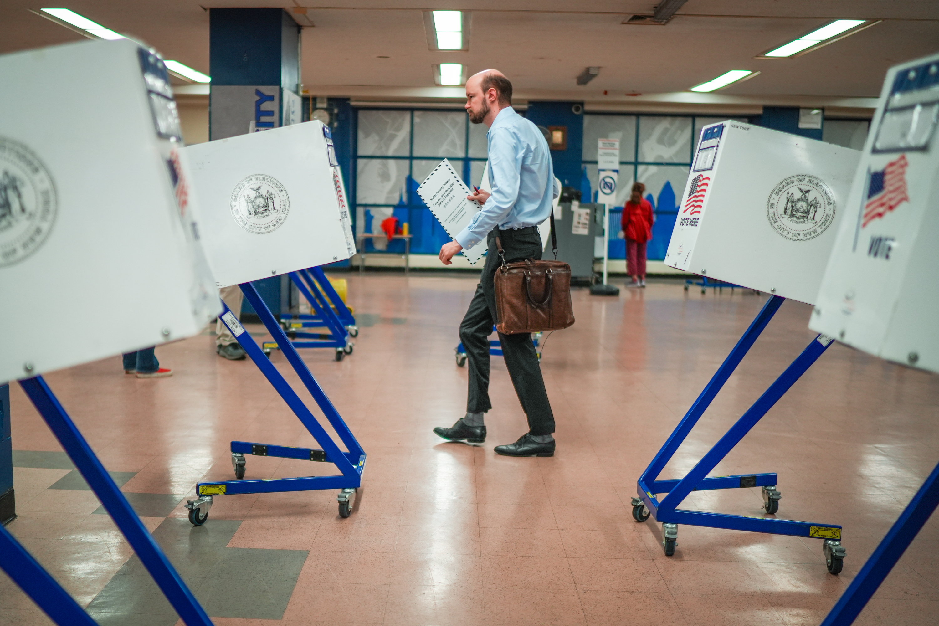 A voter casts a ballot during New York's primary election on Tuesday, June 23, 2026, in New York. (AP Photo/Ryan Murphy)