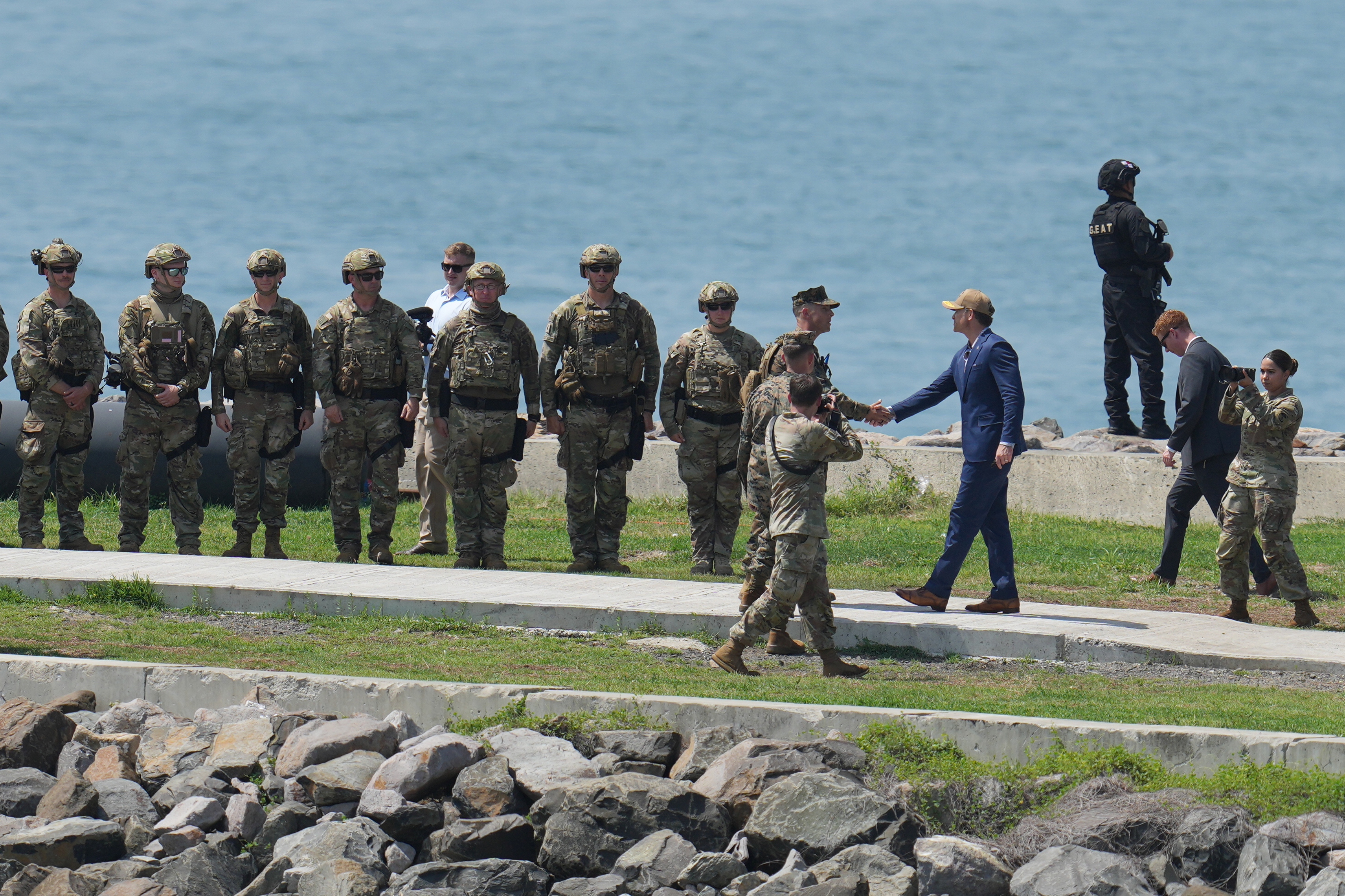U.S. Defense Secretary Pete Hegseth greets military personnel taking part in a multinational military exercise in Panama City, Thursday, Aug. 13, 2026. (AP Photo/Matias Delacroix)