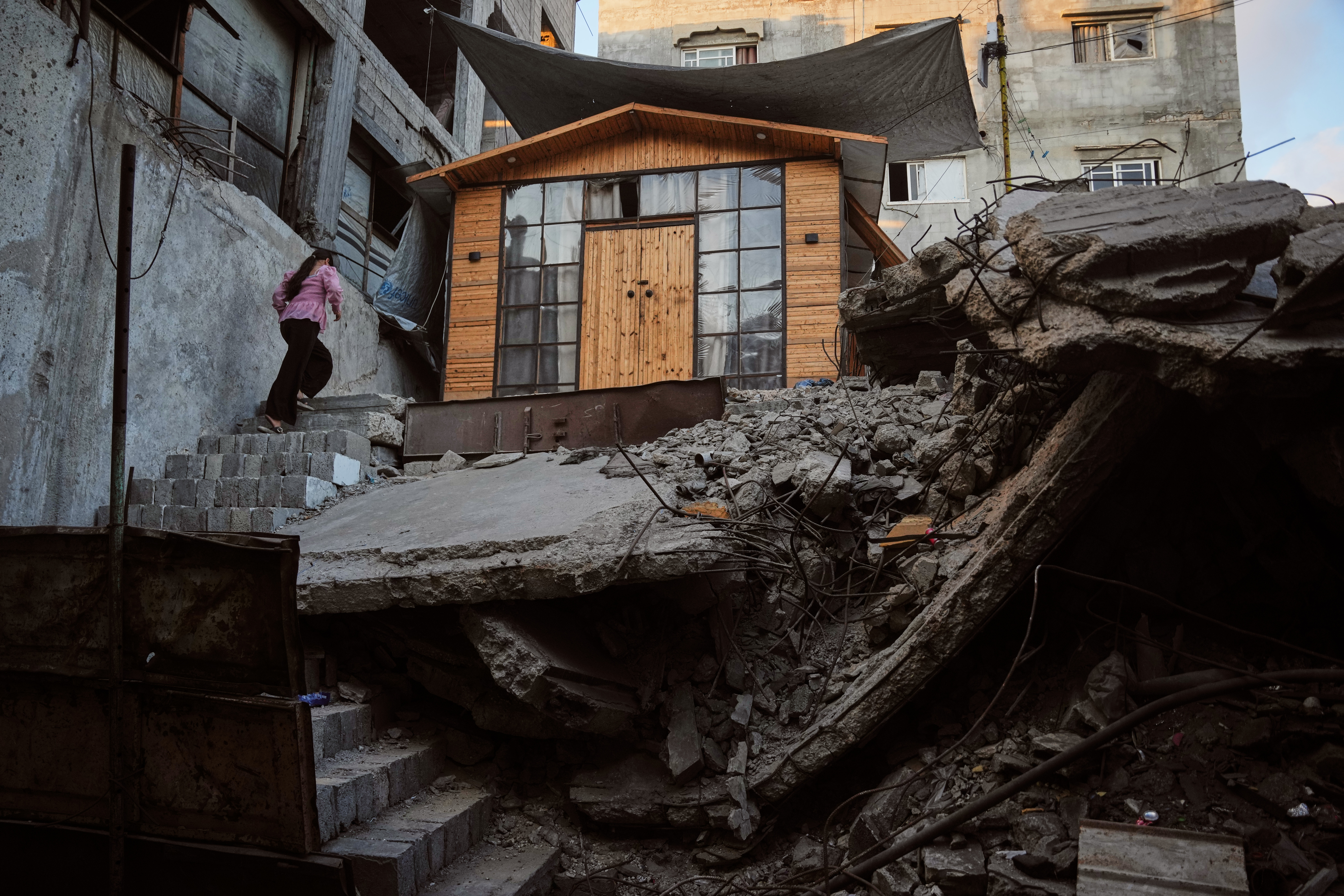 Palestinians rebuild Gaza’s ruins with mud bricks and scrap