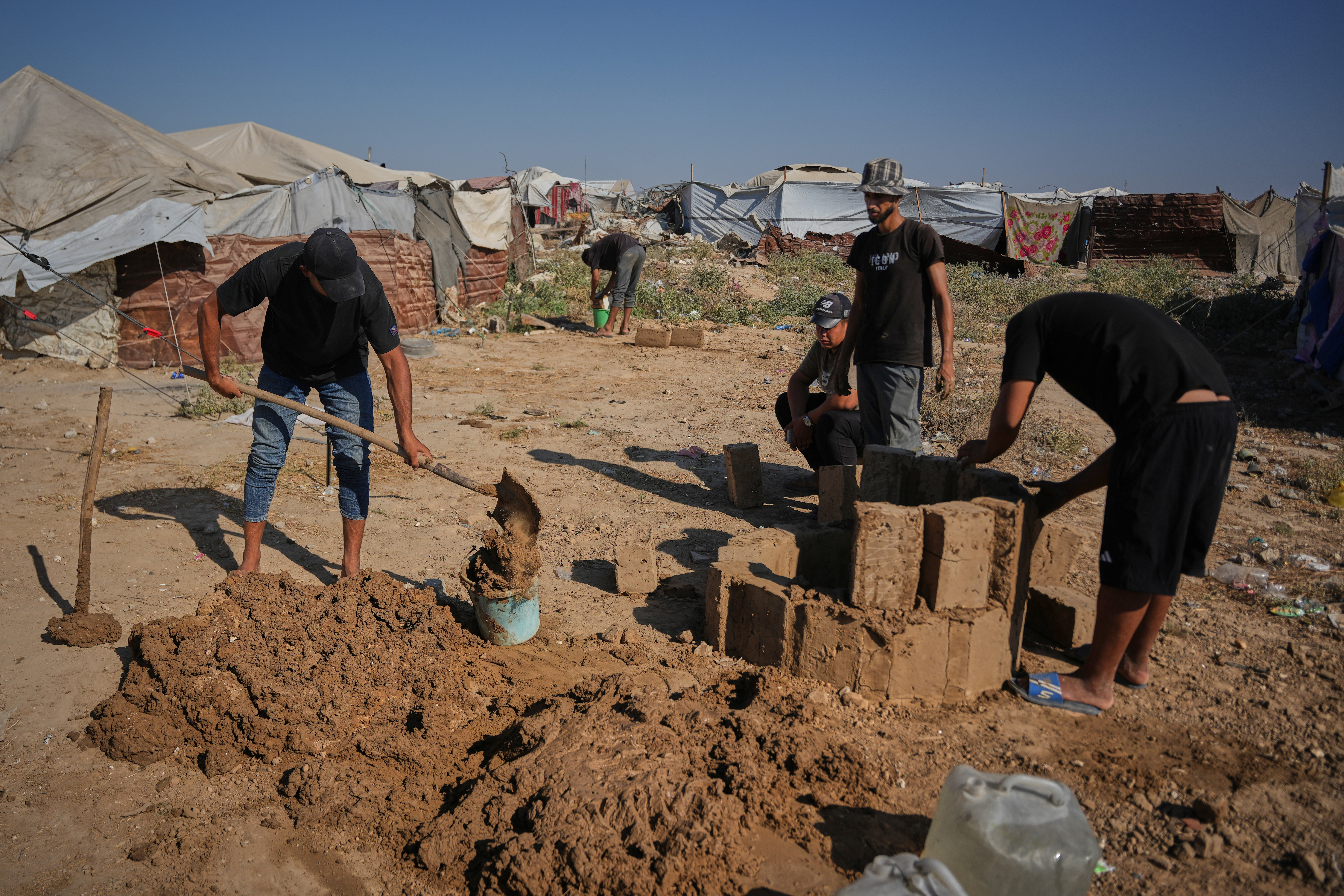 Palestinians rebuild Gaza’s ruins with mud bricks and scrap