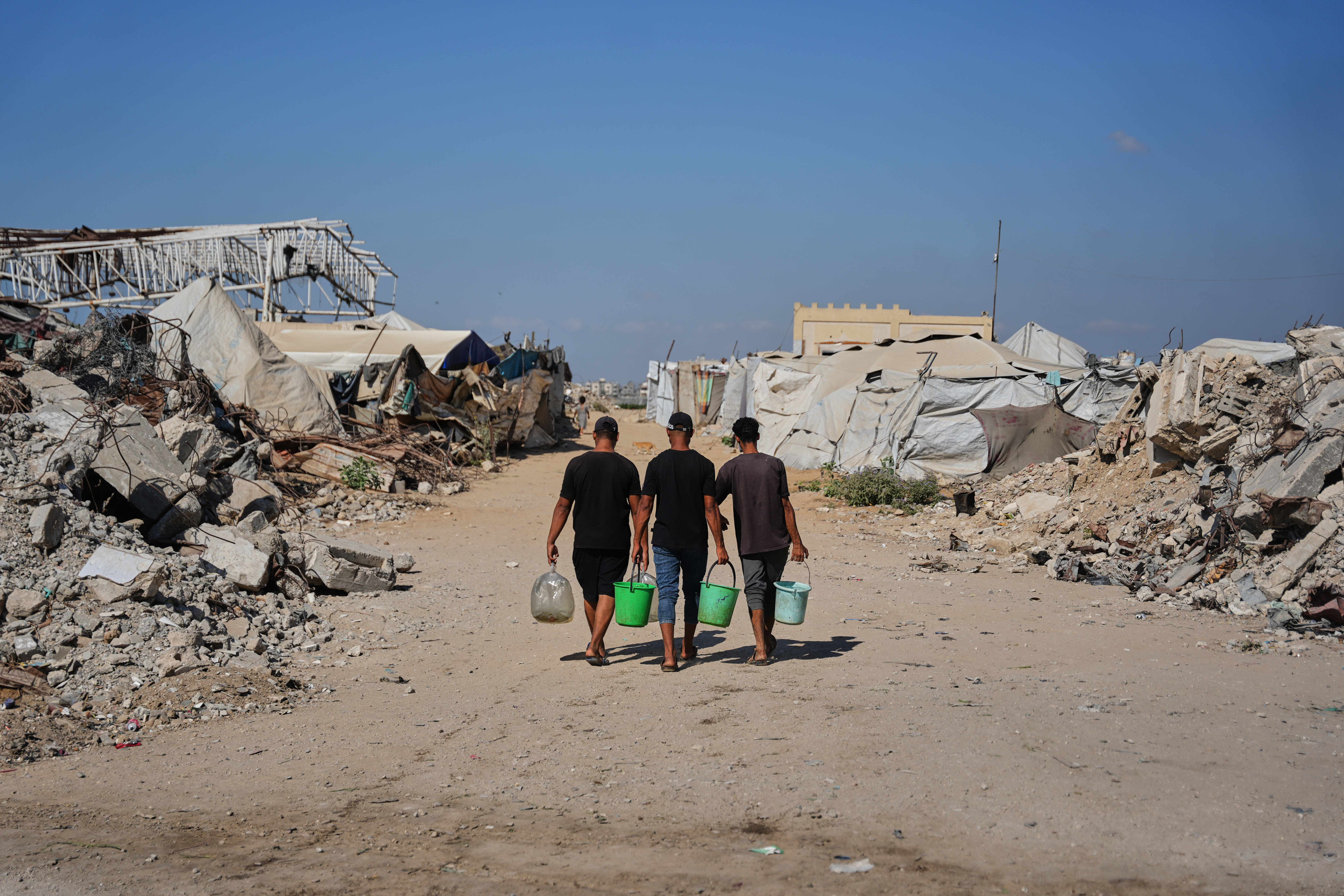 Palestinians rebuild Gaza’s ruins with mud bricks and scrap