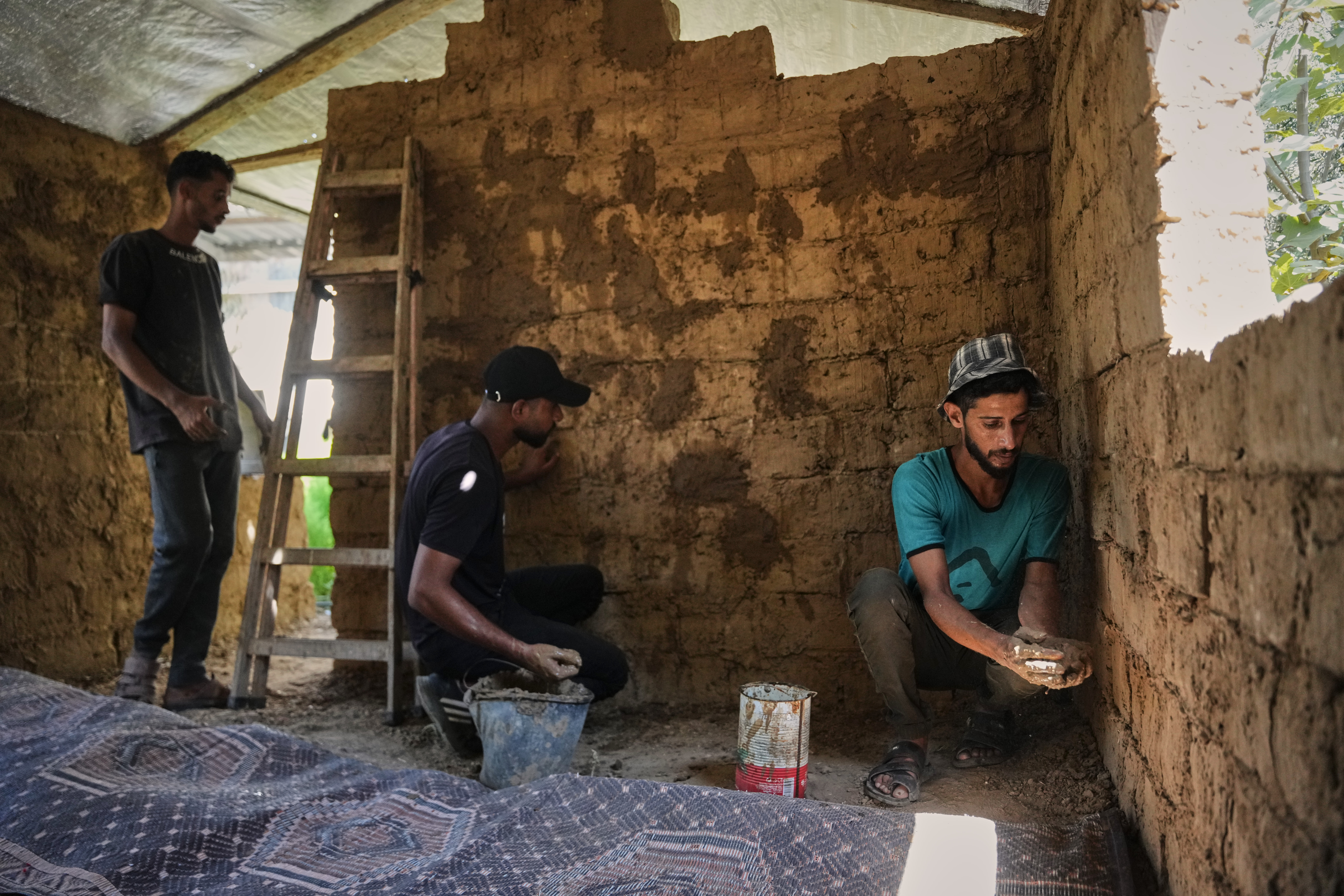 Palestinians rebuild Gaza’s ruins with mud bricks and scrap
