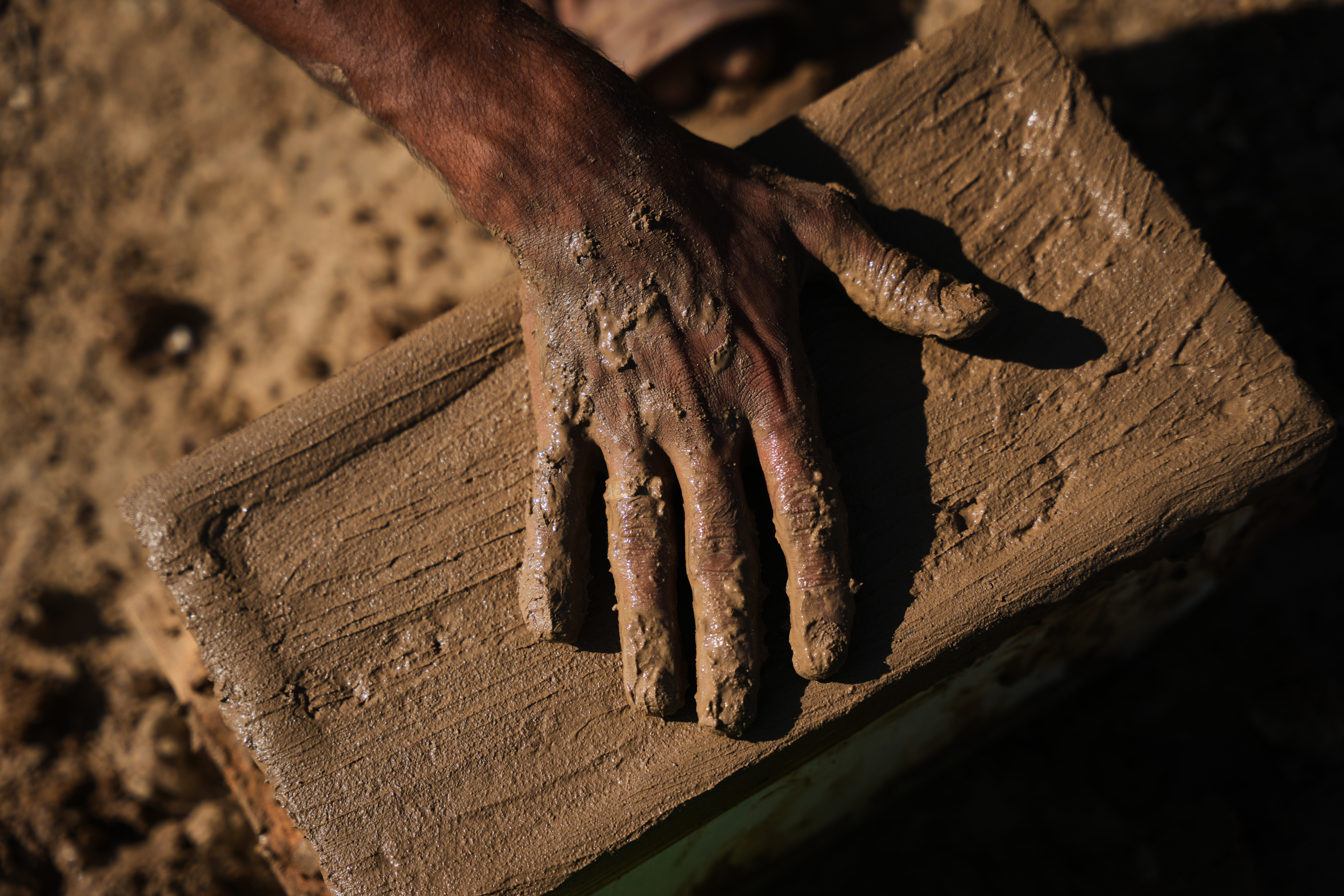 Palestinians rebuild Gaza’s ruins with mud bricks and scrap