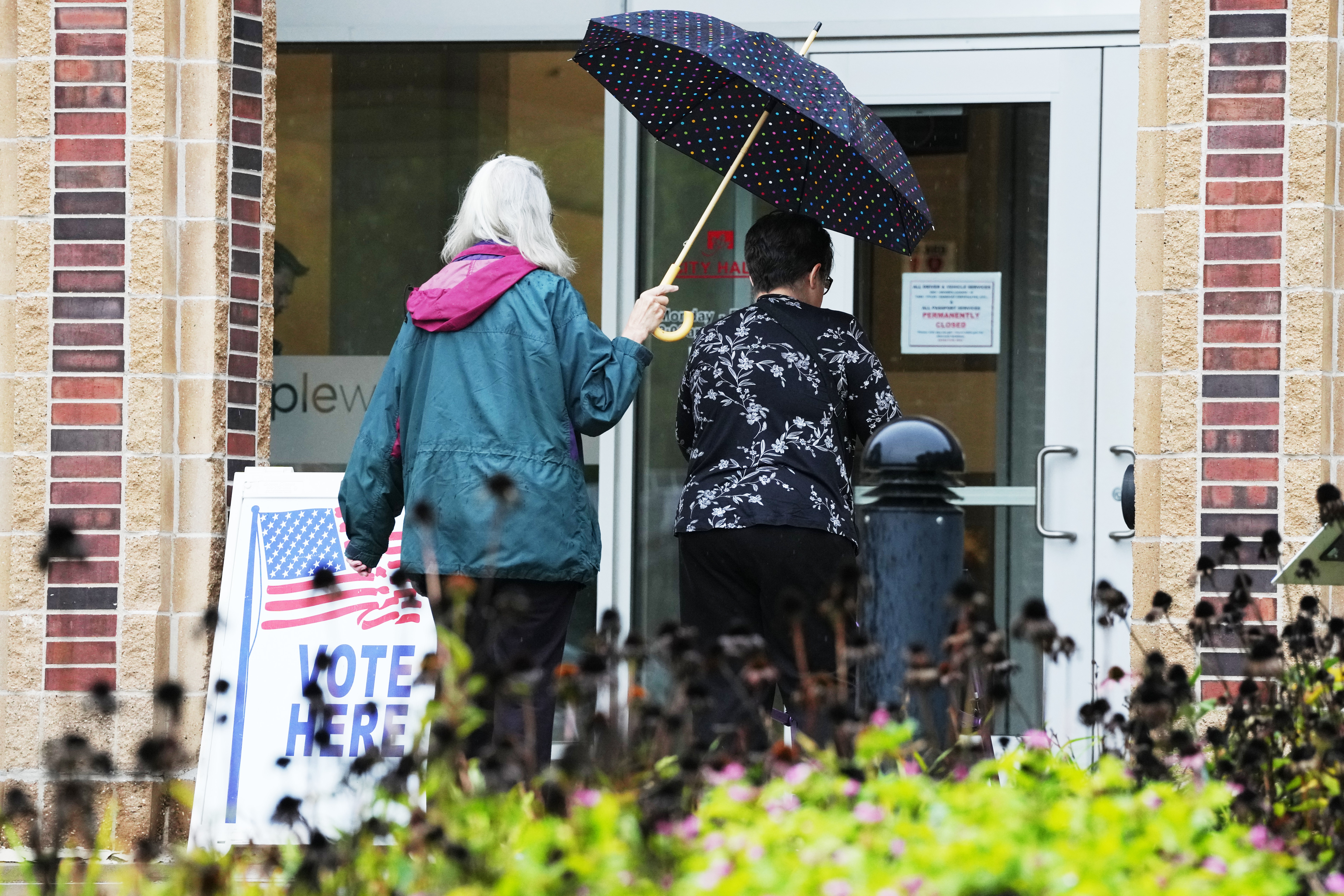 Voters walk into Maplewood City Hall on the first day of early voting in Minnesota, Friday, Sept. 18, 2026, in Maplewood, Minn. (AP Photo/Ellen Schmidt)