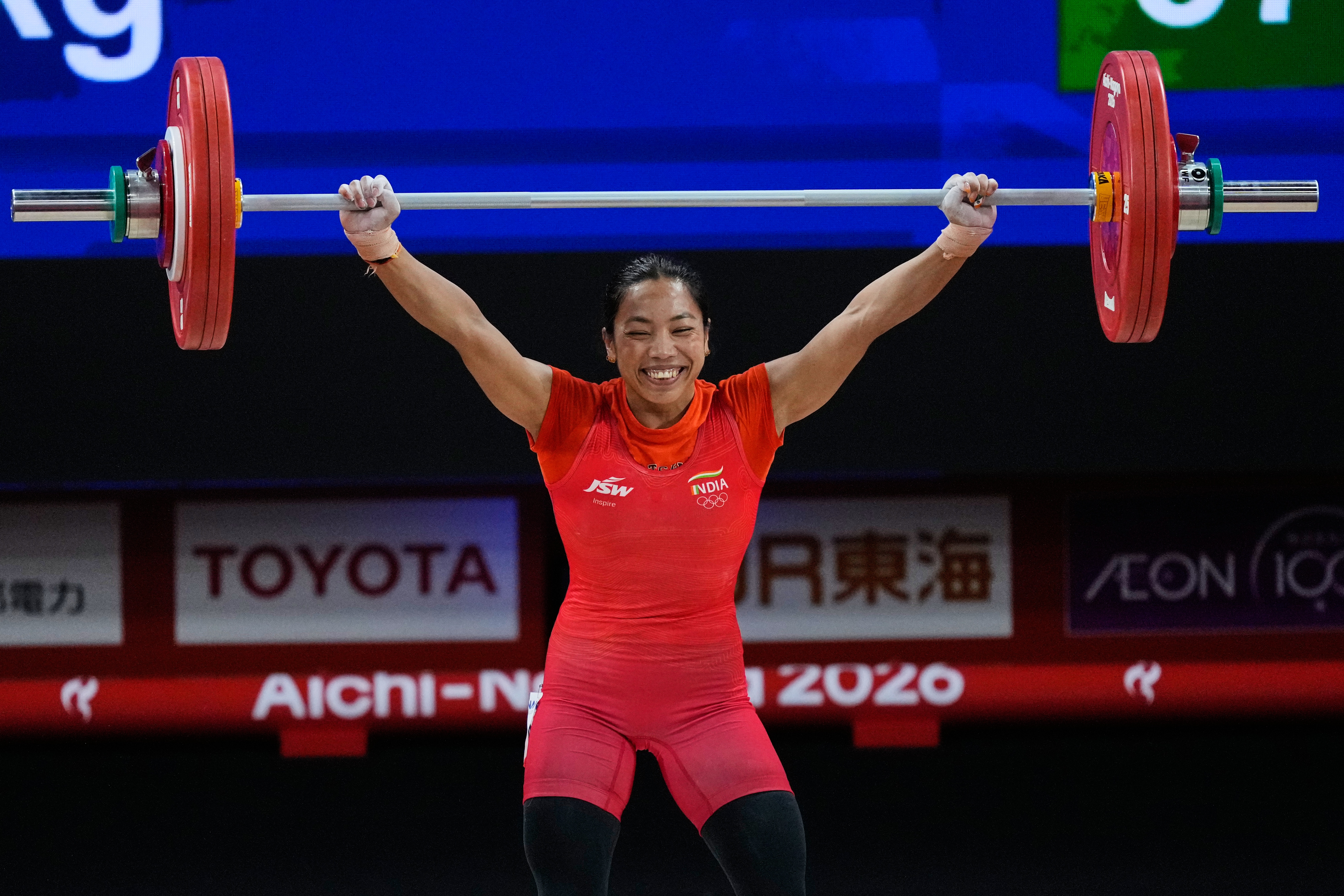 Mirabai Chanu Saikhom of India competes during the women's 49kg weightlifting final at the Asian Games in Nagoya, Japan, Wednesday, Sept. 23, 2026. (AP Photo/Dita Alangkara)