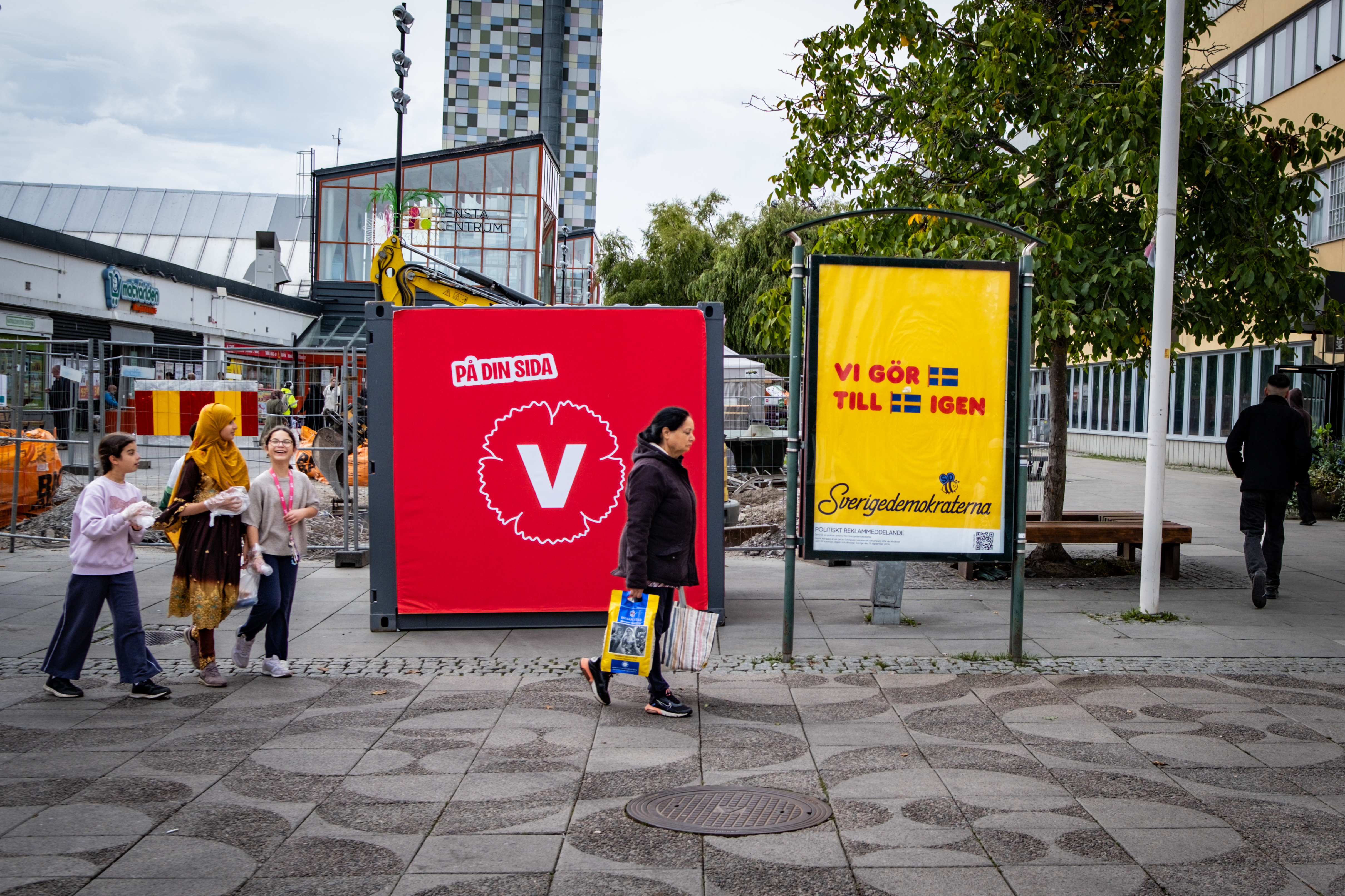 A poster for the Left Party (L) and the Sweden Democrats (R) stand side by side in the Stockholm suburb of Tensta