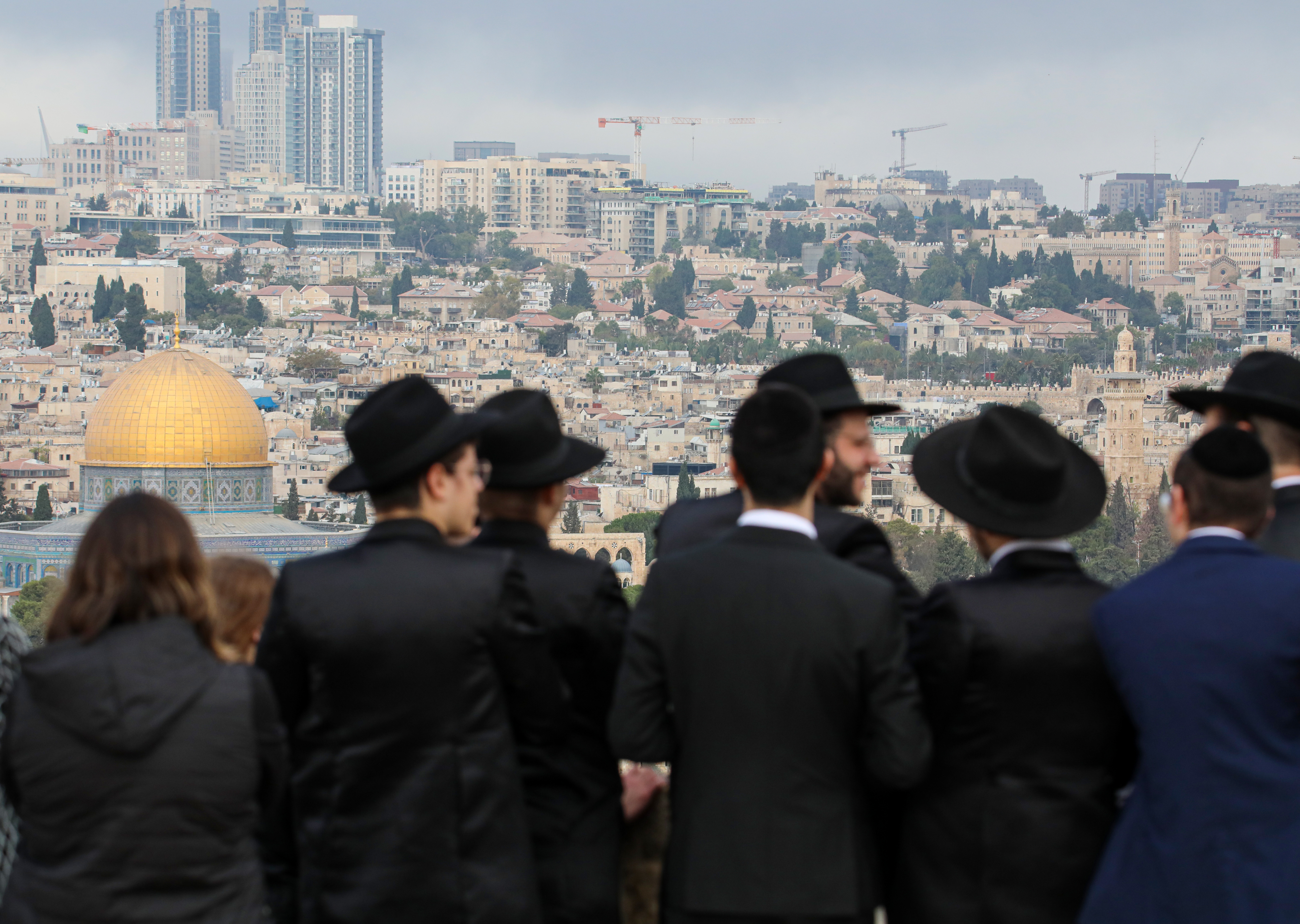 Hundreds of Jewish settlers worship atop buildings in Jerusalem's Old City overlooking the Western Wall on the third day of the Sukkot, a Torah-commanded Jewish holiday, in Jerusalem on October 09, 2025. [Gazi Samad/Anadolu via Getty Images]