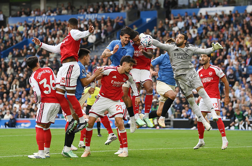 Pascal Struijk of Brighton & Hove Albion heads the ball wide whilst under pressure from Gabriel and David Raya of Arsenal