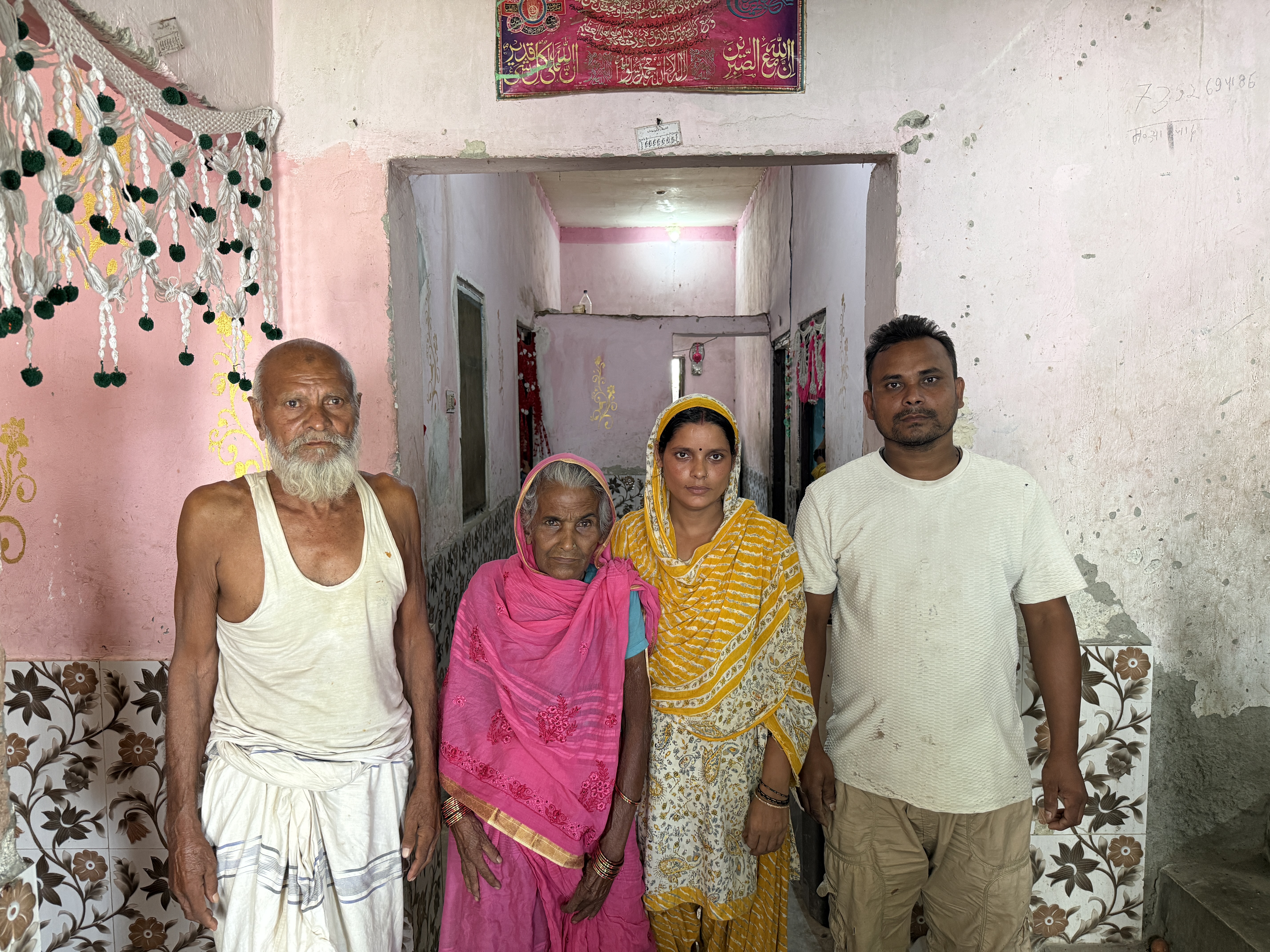 Neyaz Miya (far right), with his wife Rijwana Khatun, his mother Rubaida Khatun, and his father Doshahmad Miya. Neyaz survived the floods, but lost his masonry tools, worth almost $1000