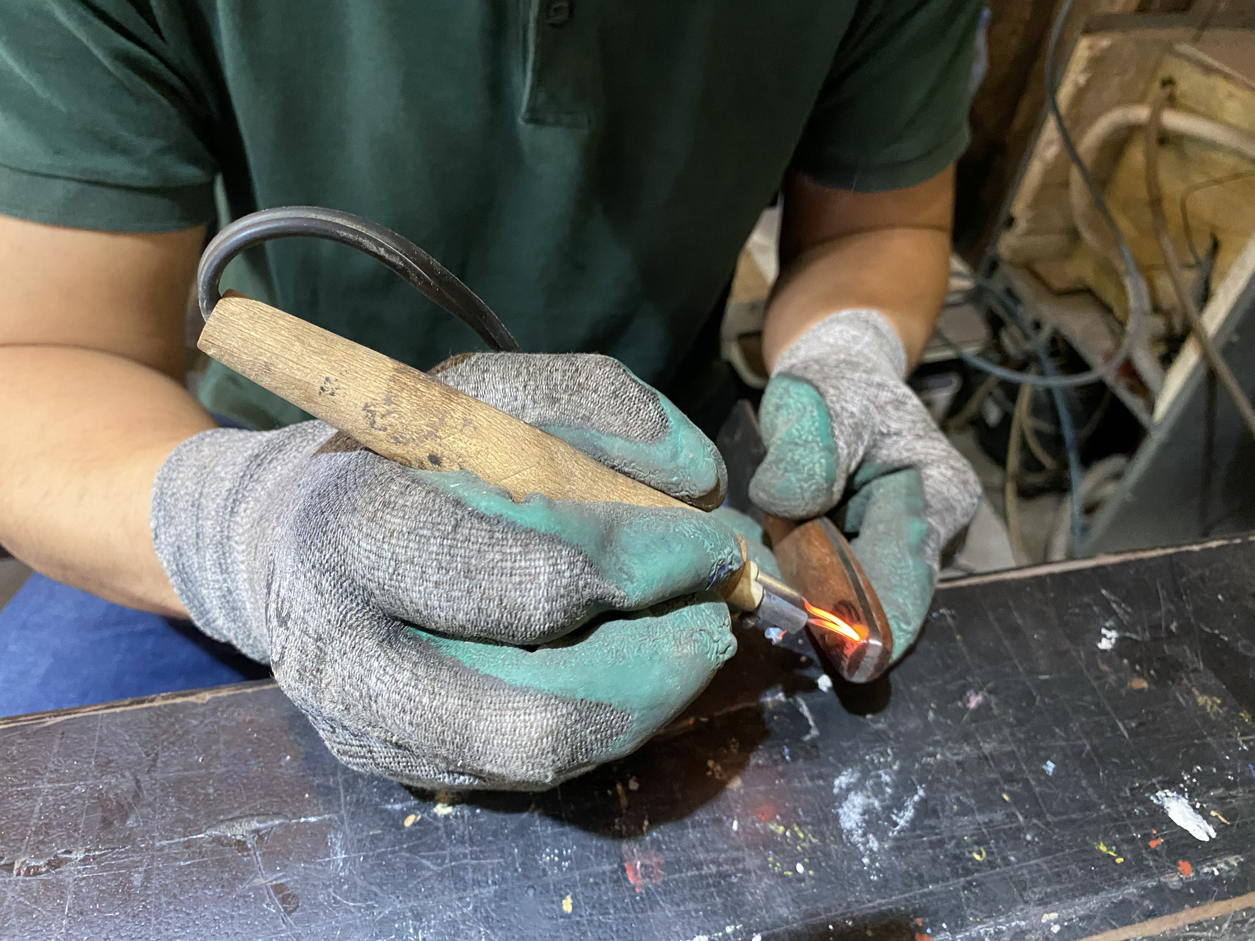 Yagiız Can Sonmez works on a piece at the Akdemir forge. He describes blacksmithing as a process of projecting “what’s in your mind and soul onto a hard metal”