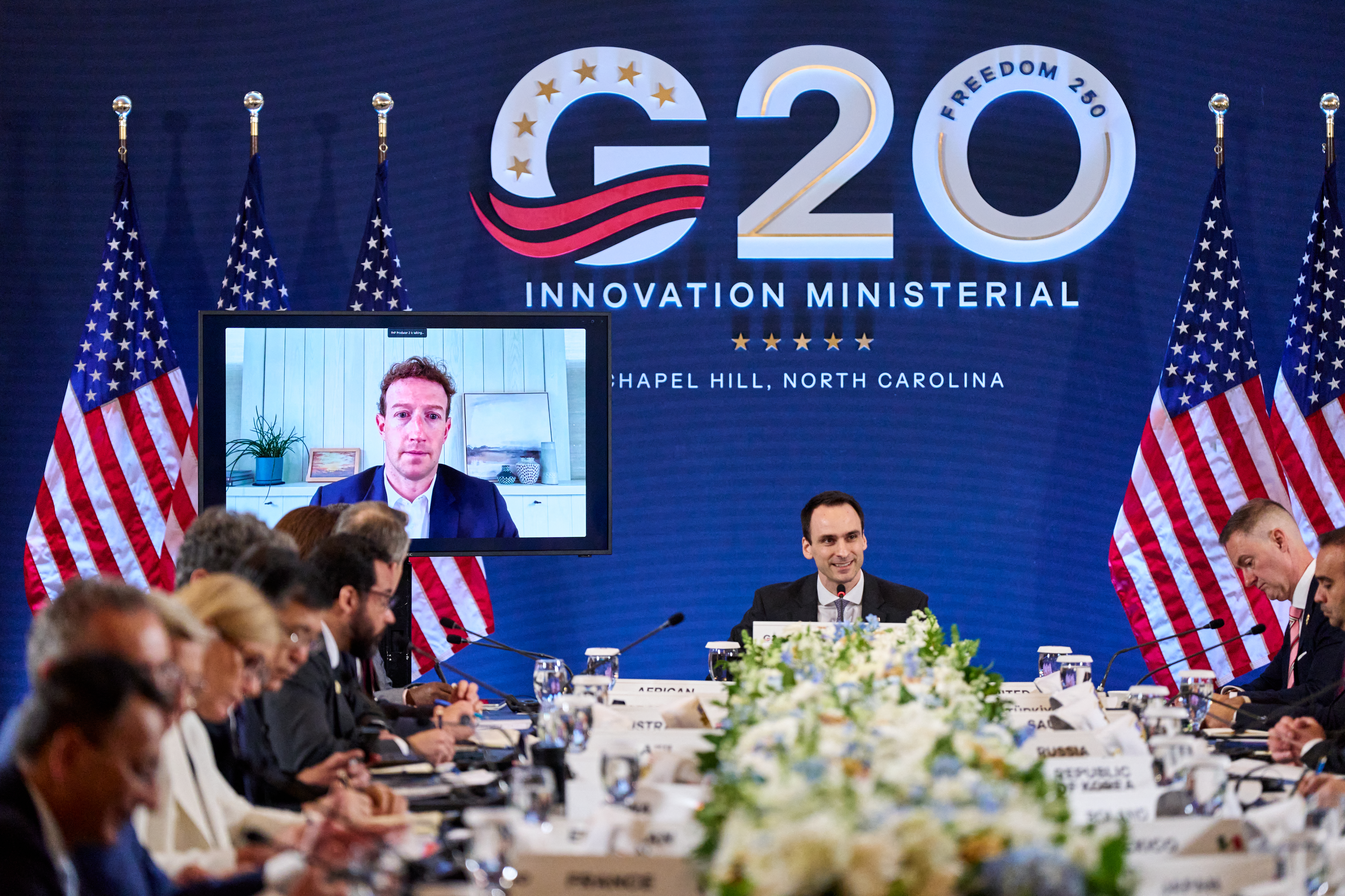 Meta CEO Mark Zuckerberg is displayed on a screen as White House Office of Science and Technology Policy Director Michael Kratsios speaks during the G20 Innovation Ministerial meeting in Chapel Hill, North Carolina, on September 1, 2026.