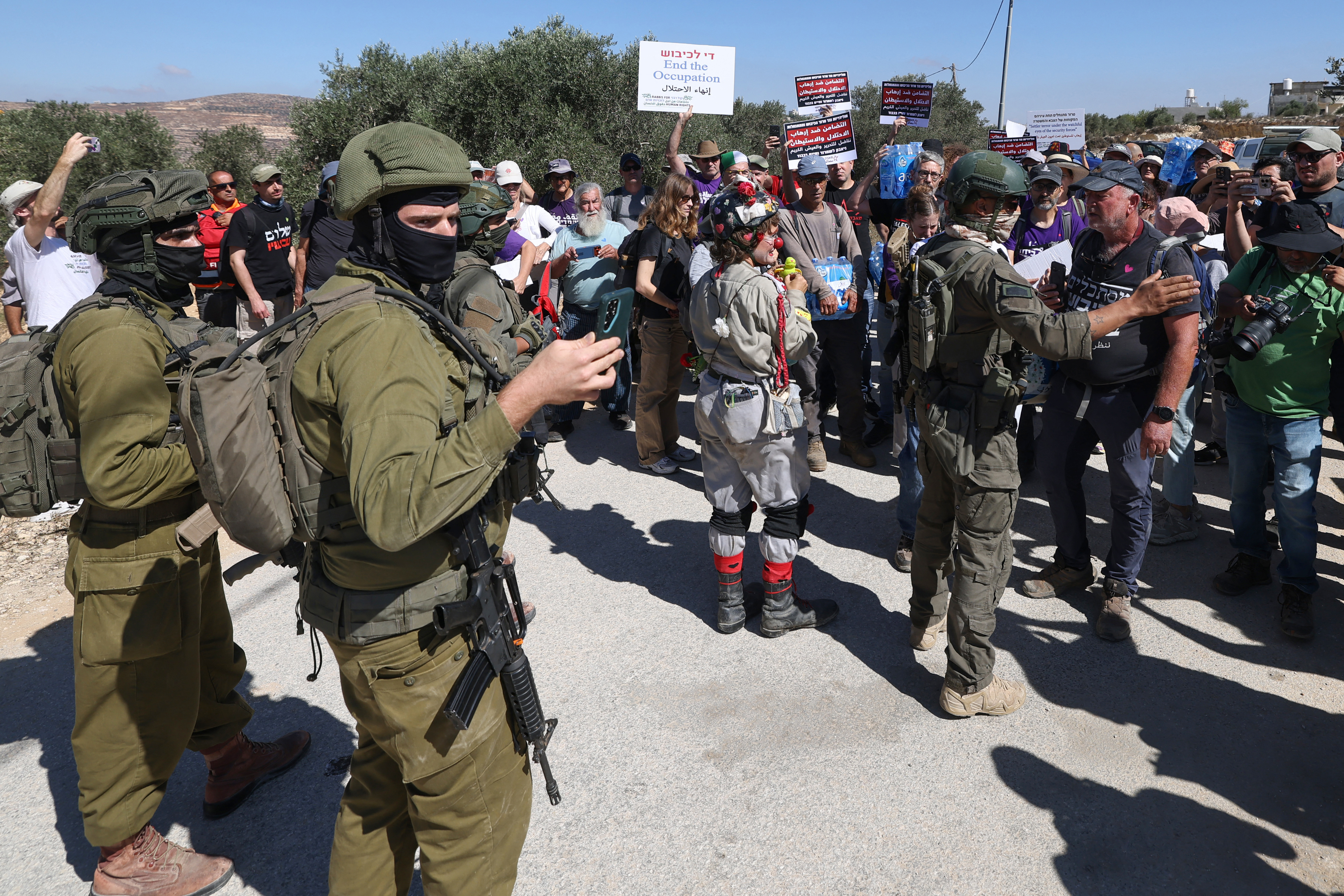 Israeli forces block peace activists carrying food and water from reaching Palestinian families whose homes have been cut off supplies by Israeli settlers in the village of Qusra, south of the city of Nablus in the Israeli-occupied West Bank, on September 4, 2026.