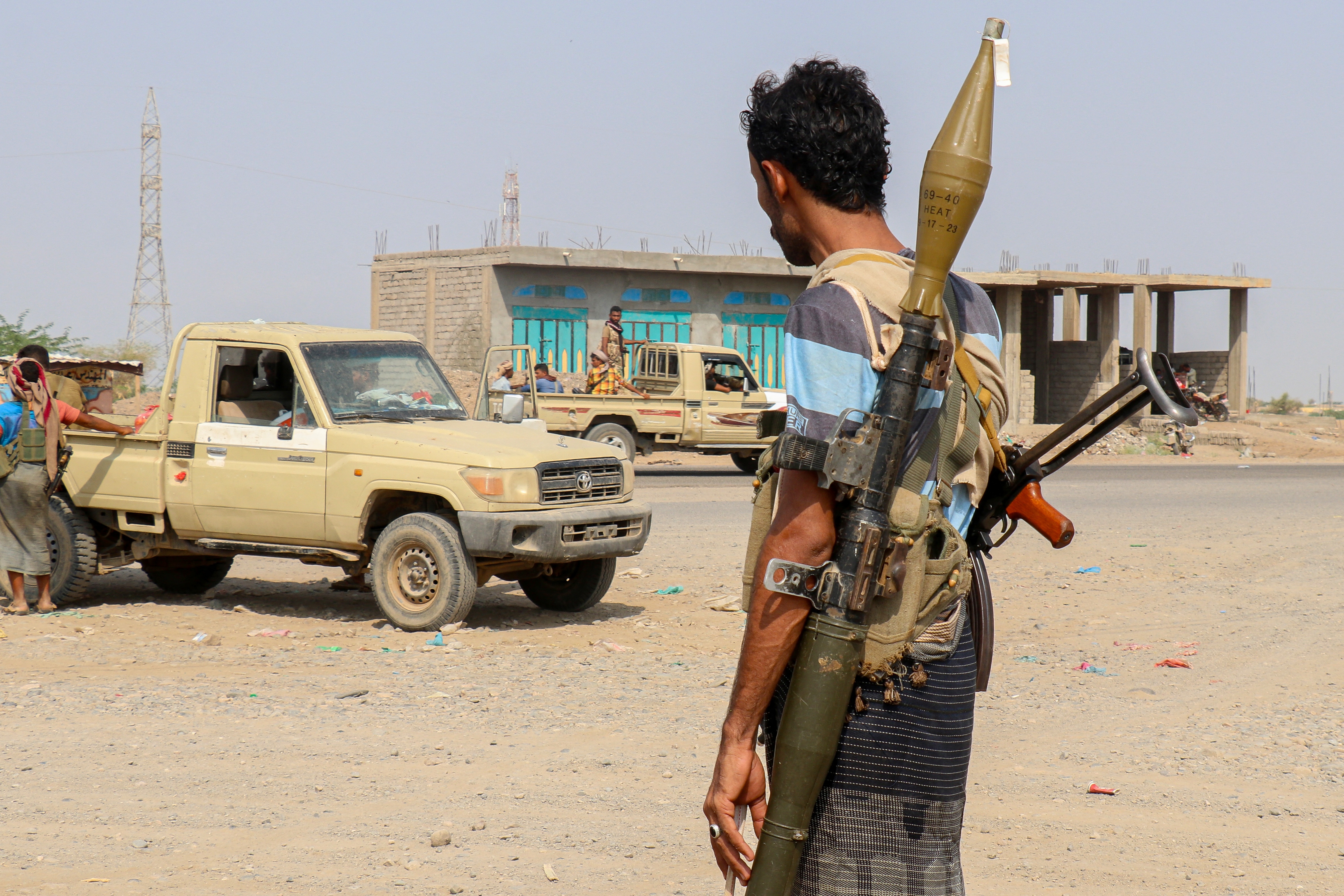 Soldiers loyal to Yemen’s Saudi-backed government stand near pick-up trucks in the Hais district, south of Hodeidah on September 5, 2026 [AFP]