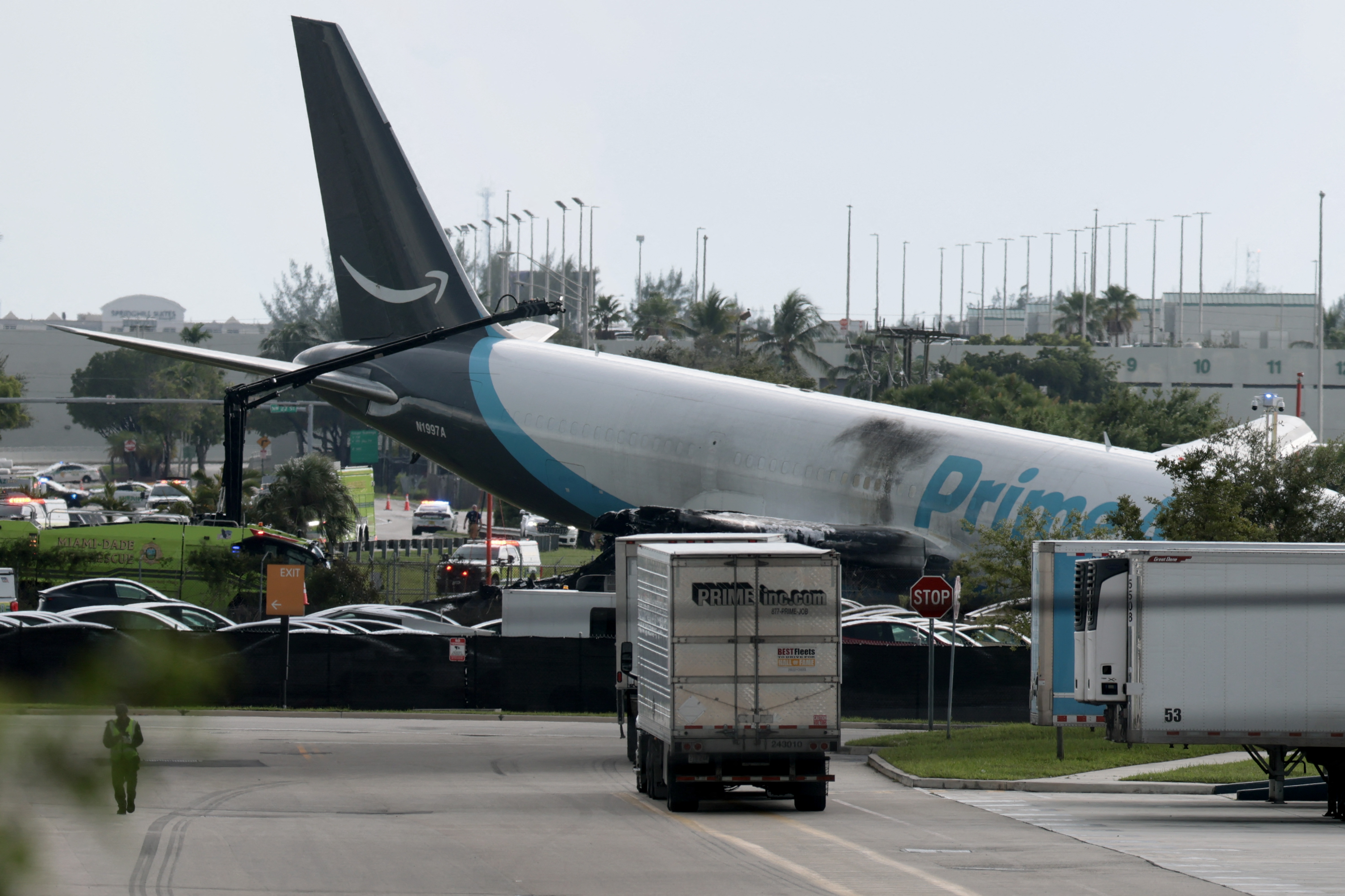 MIAMI, FLORIDA - SEPTEMBER 06: An Amazon cargo plane is seen after it crashed at Miami International Airport on September 06, 2026 in Miami, Florida. In a statement, the Federal Aviation Administration said Prime Air Flight 7598 overran the runway while landing around 2 p.m. after departing from Luis Muñoz Marín International Airport in San Juan, Puerto Rico, earlier today. Joe Raedle/Getty Images/AFP (Photo by JOE RAEDLE / GETTY IMAGES NORTH AMERICA / Getty Images via AFP)