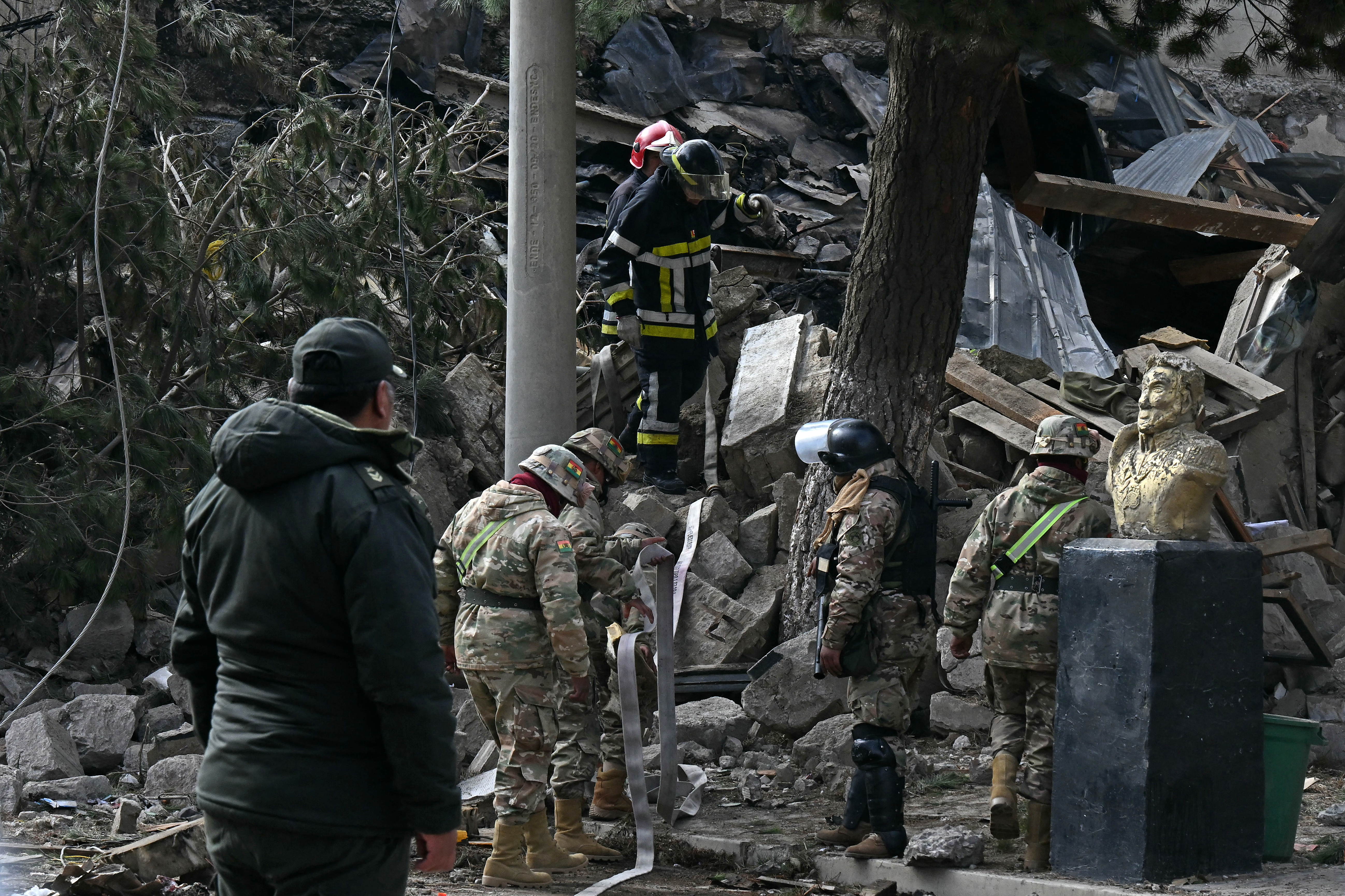 Military personnel and firefighters check damages following an explosion at an army barracks on the eve, in Viacha, Bolivia, on September 5, 2026.