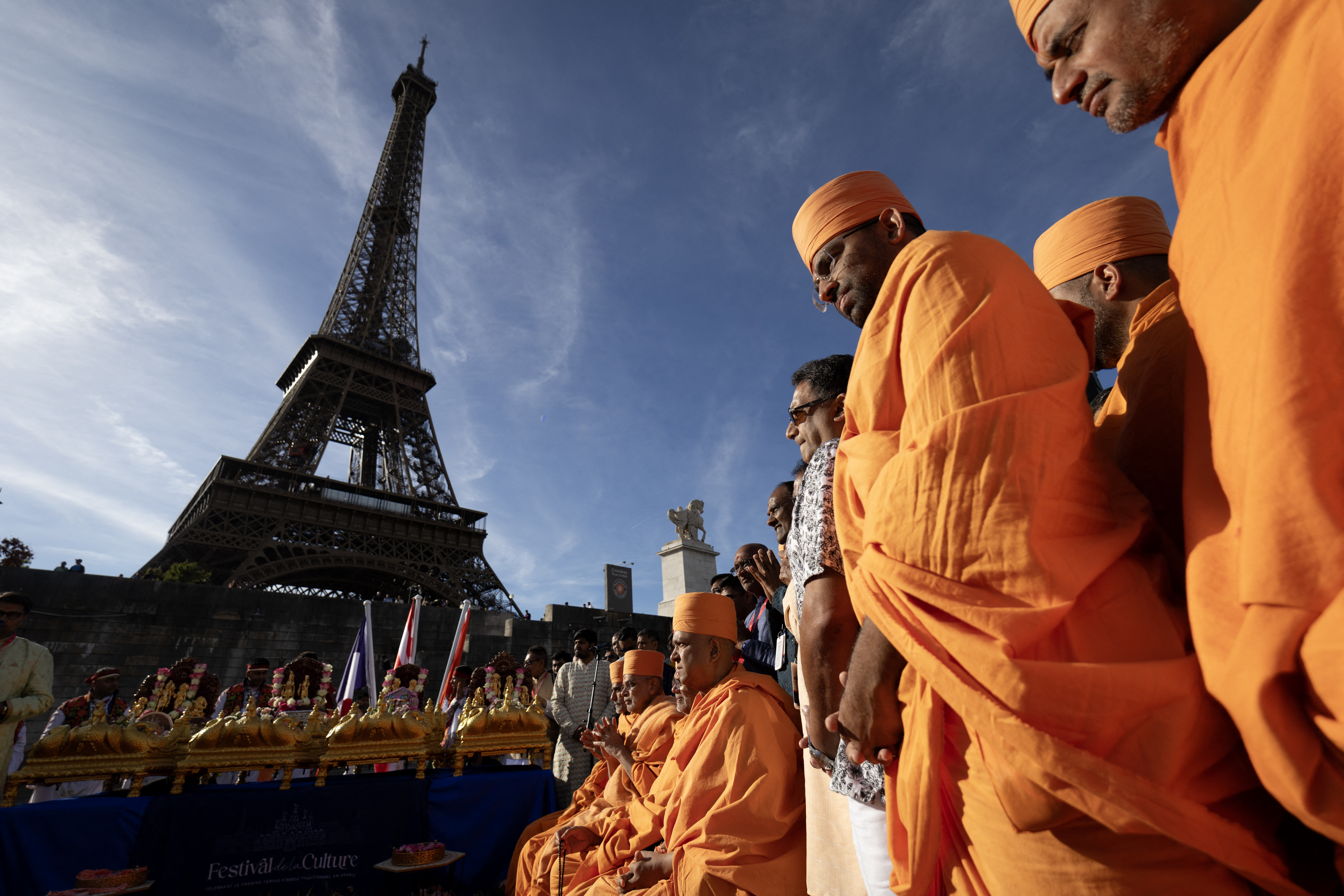 Bochasanwasi Akshar Purushottam Swaminarayan Sanstha (BAPS) Hindu monks take part in a religious ceremony in front of the Eiffel Tower before a ceremonial river parade on the river Seine in Paris on September 3, 2026.