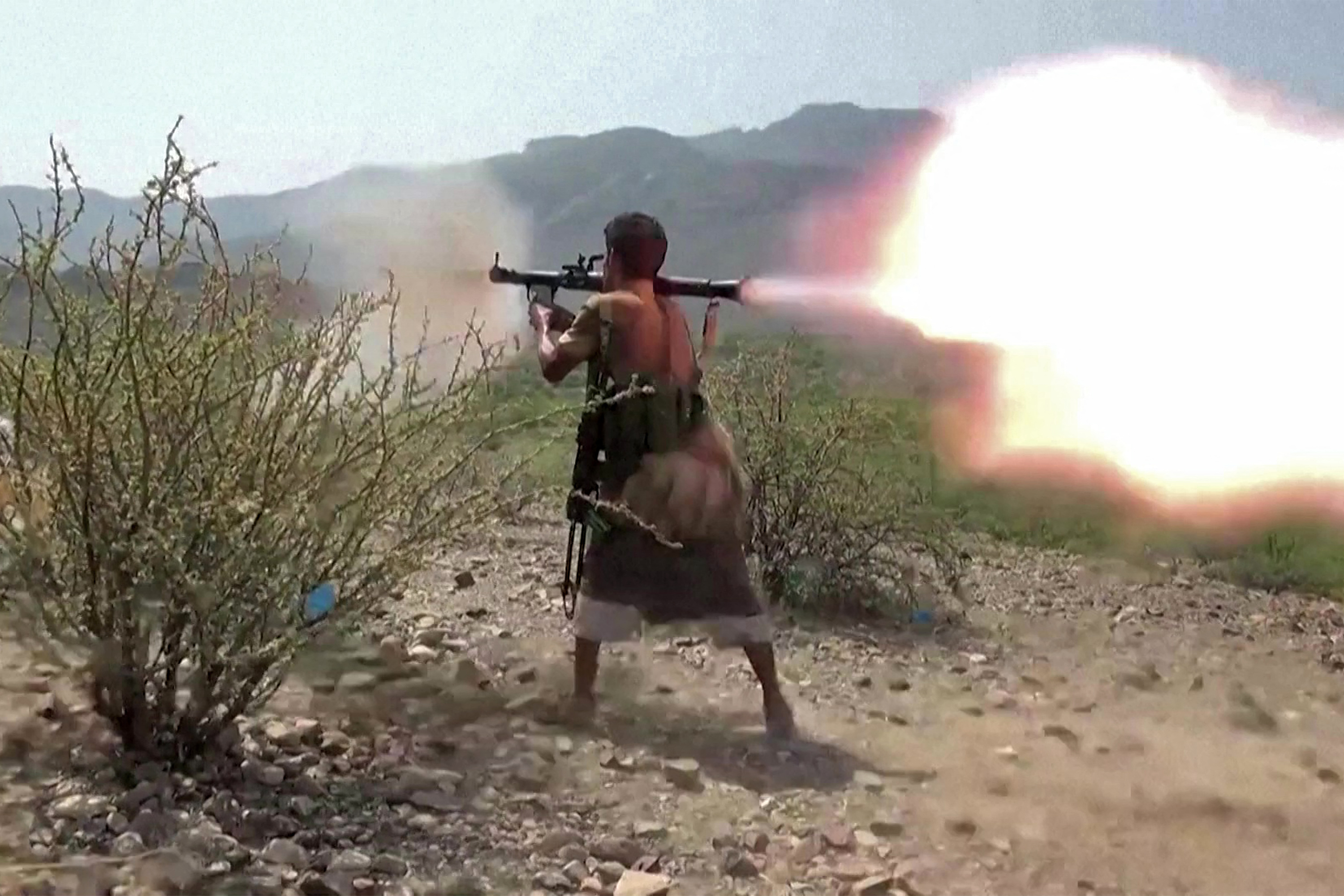 TOPSHOT - This screen grab taken from video footage released on September 8, 2026 by the Saudi-backed National Resistance Forces in Yemen shows a fighter firing a rocket-propelled grenade (RPG), as Yemeni government forces and National Resistance Forces fire at Houthi fighters on the Kadha front, west of the city of Taiz in Yemen's western Taiz province.