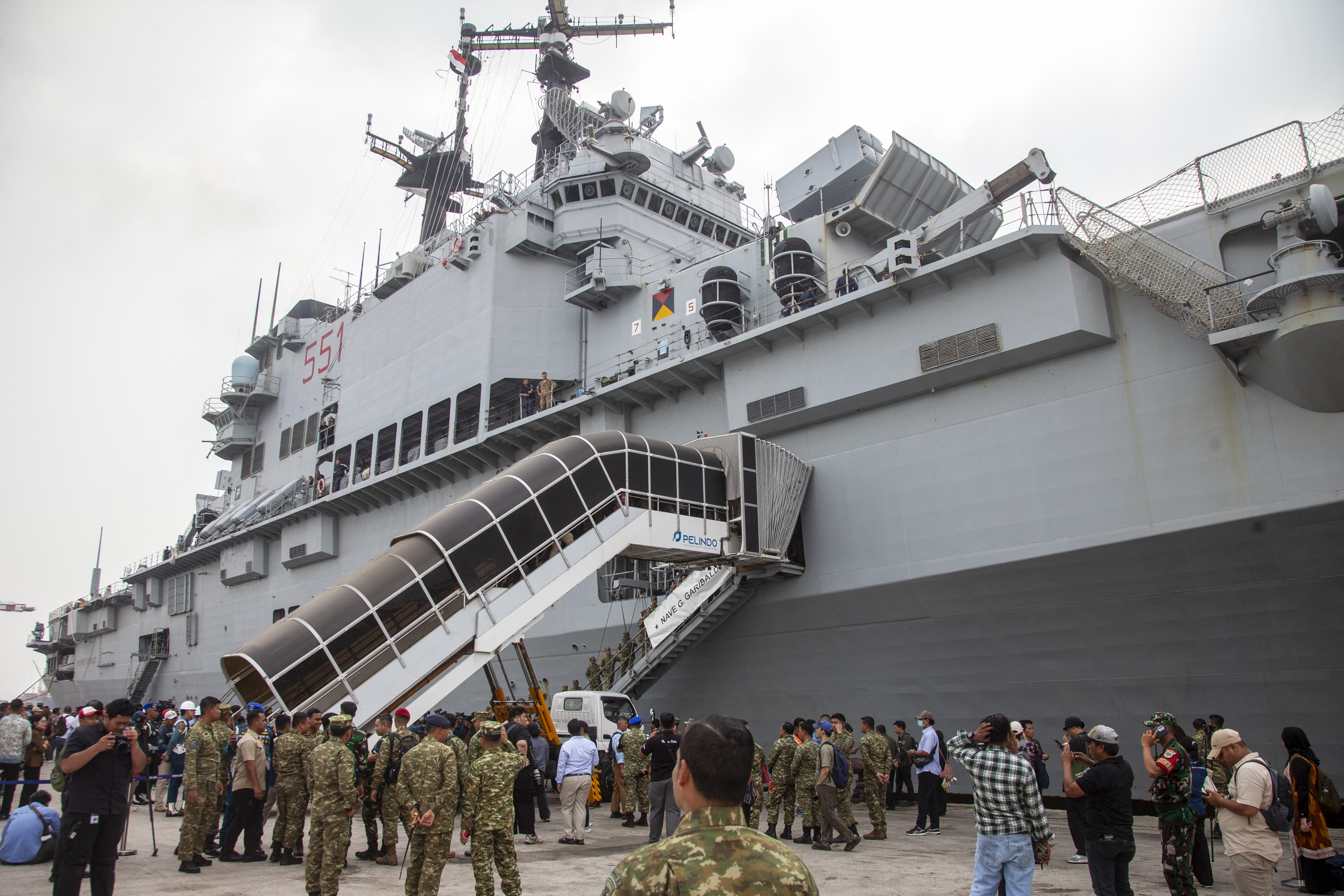 Former Italian Navy aircraft carrier Giuseppe Garibaldi docks at Tanjung Priok port in Jakarta on September 18, 2026, ahead of its handover to the Indonesian Navy.