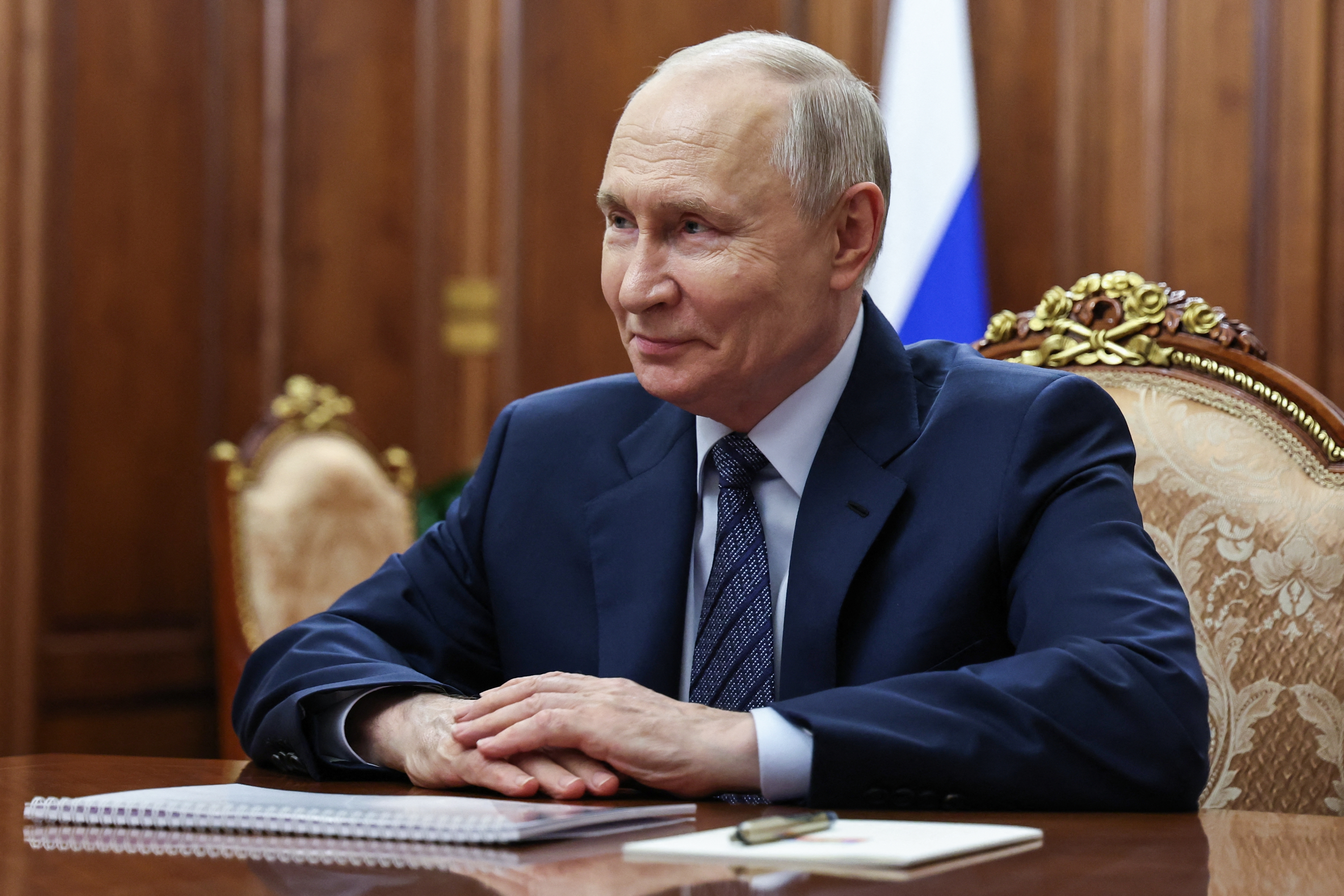 In this pool photograph distributed by the Russian state agency Sputnik, Russia's President Vladimir Putin attends a meeting with the head of the Federal Customs Service in Moscow on September 21, 2026. (Photo by Vyacheslav PROKOFYEV / POOL / AFP)