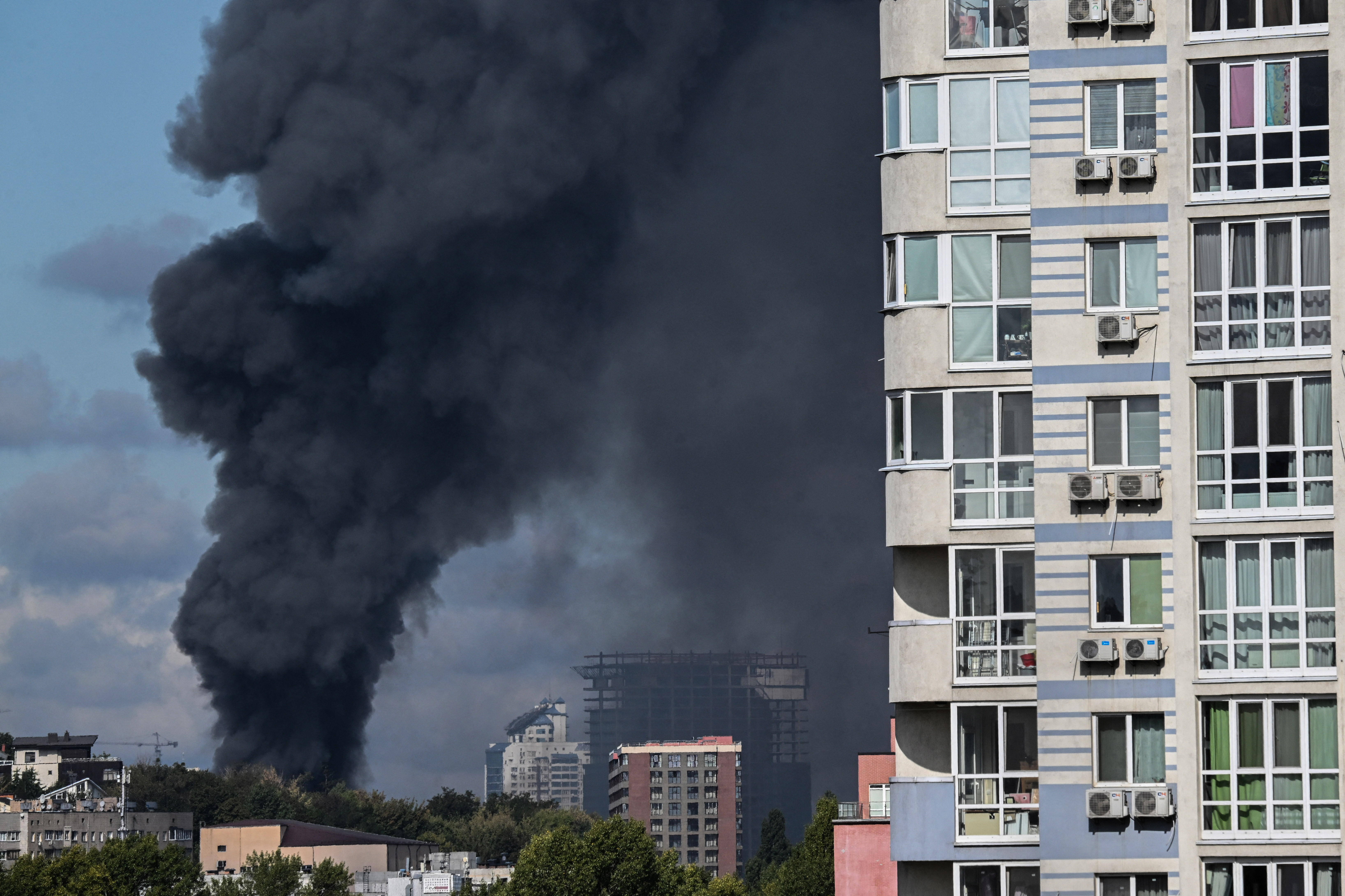 Smoke rises above the city following an air attack in Kyiv on September 23, 2026, amid the Russian invasion of Ukraine.