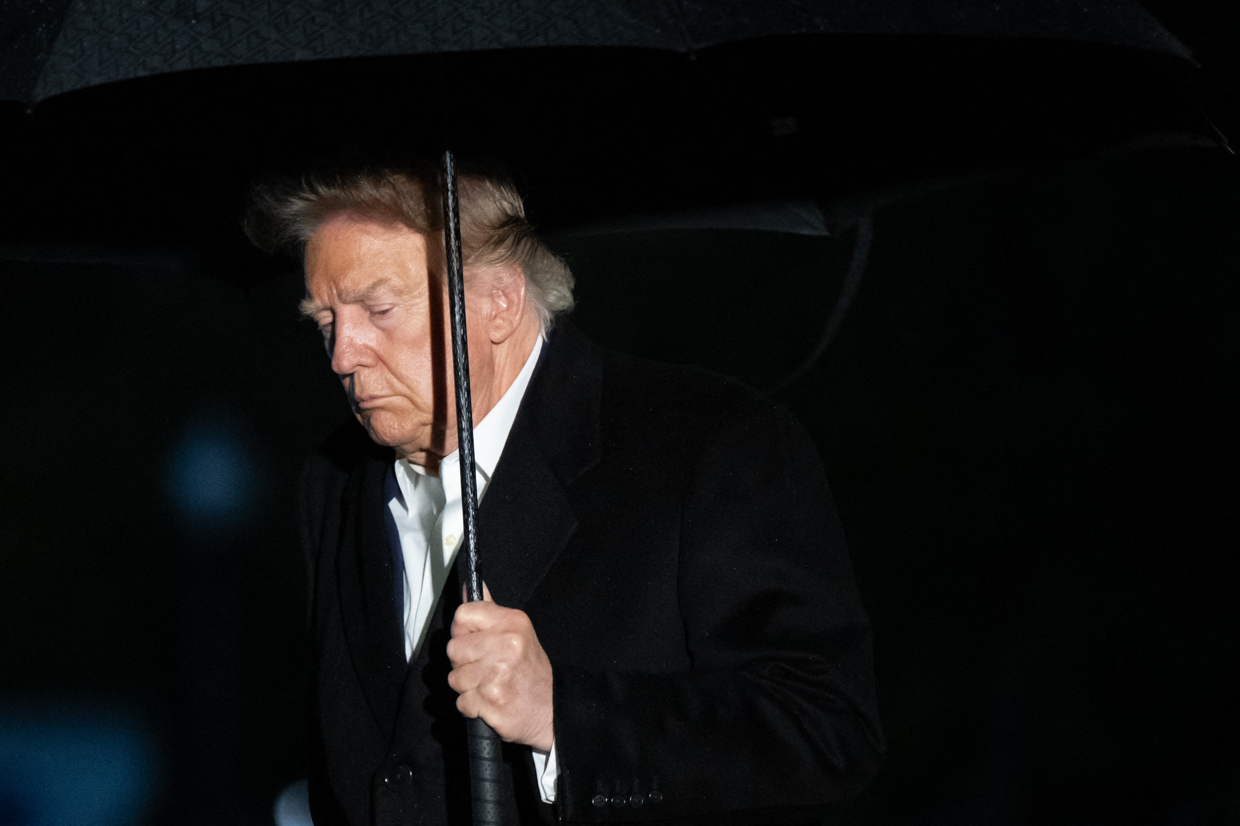 US President Donald Trump walks away from Marine One upon arrival at the South Lawn of the White House in Washington, DC, in the early hours of September 23, 2026.