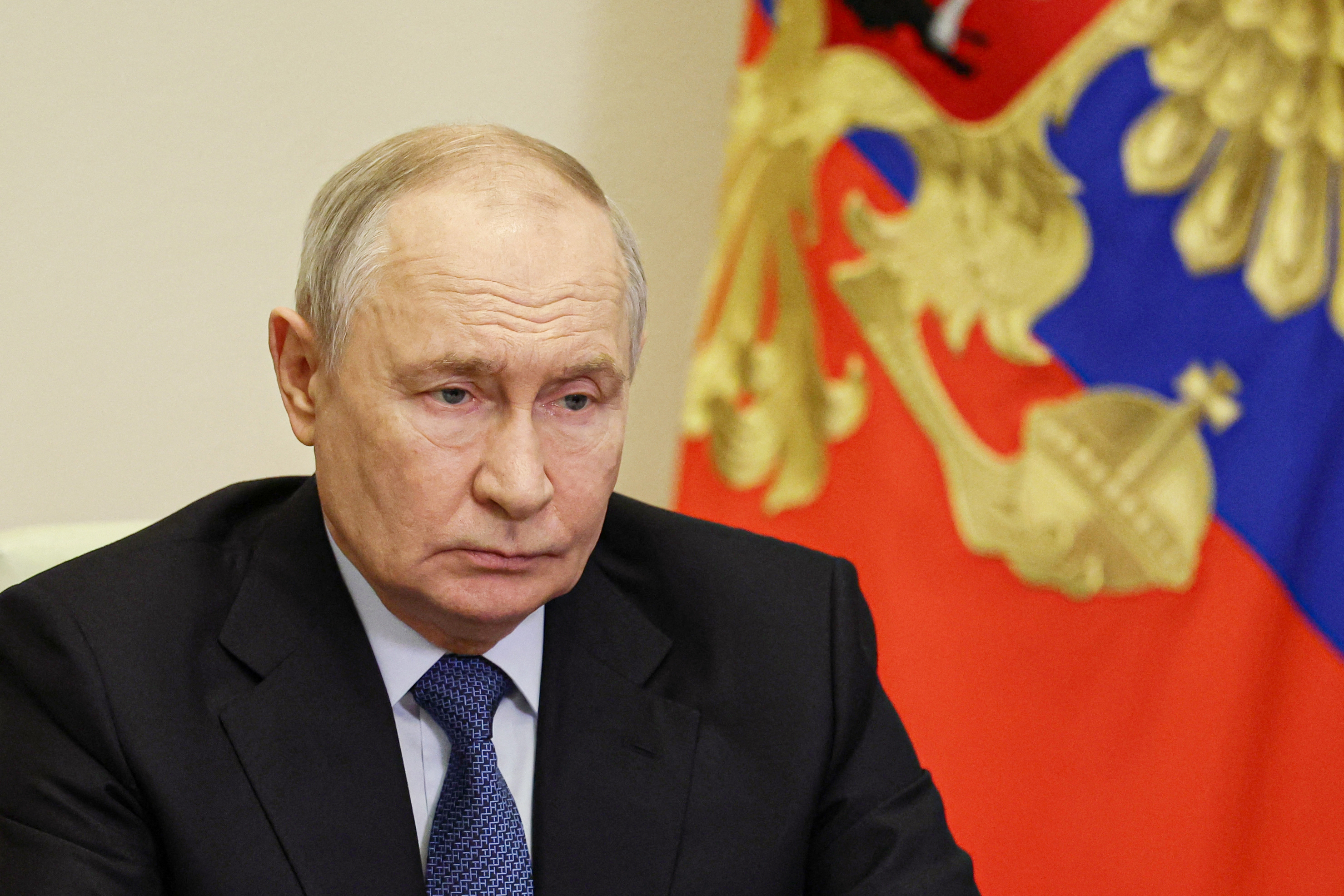 In this pool photograph distributed by the Russian state agency Sputnik, Russia's President Vladimir Putin chairs a meeting with government members via a video link in Moscow on September 23, 2026.
