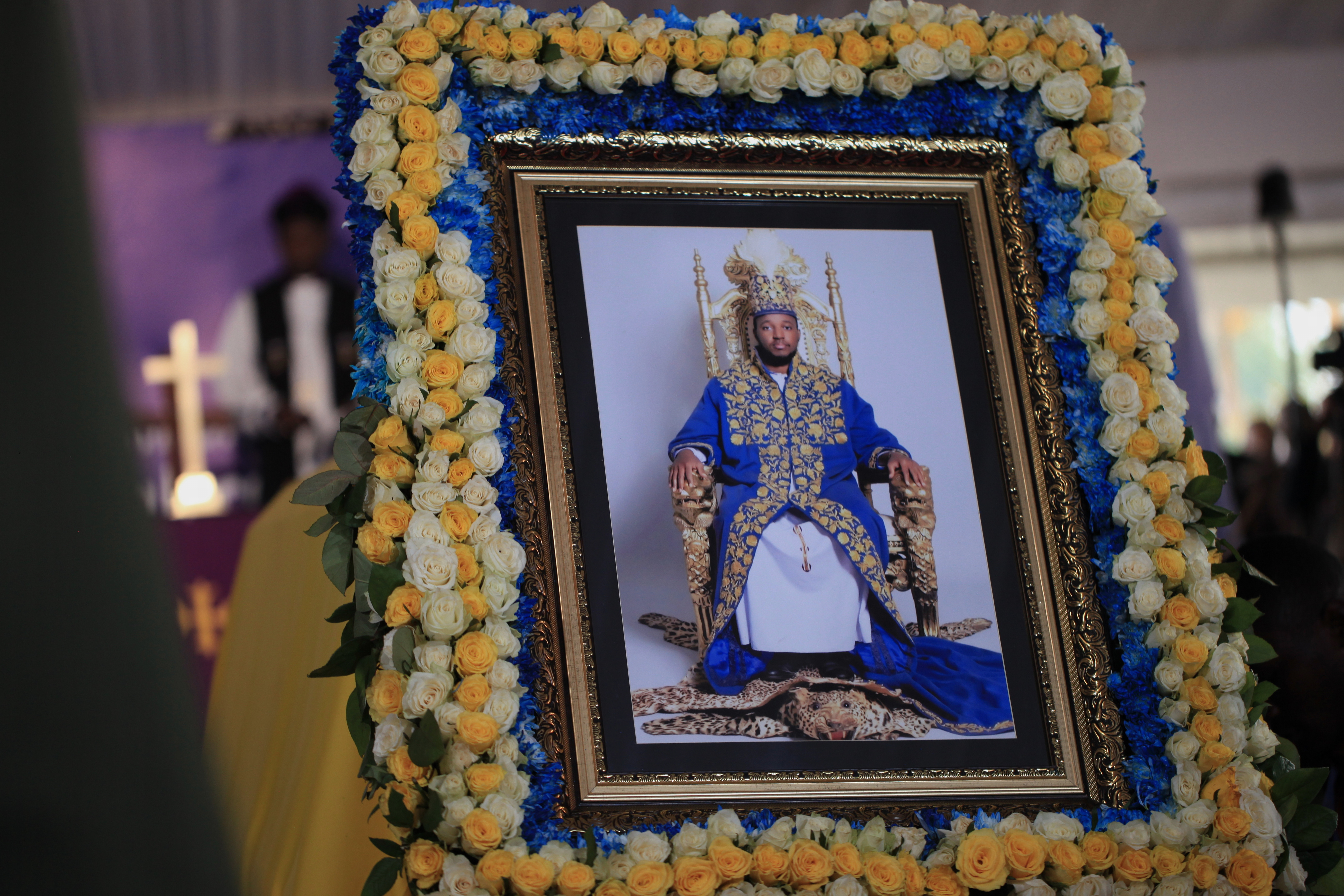 A portrait of Tooro's King Oyo Nyimba is displayed in a church.