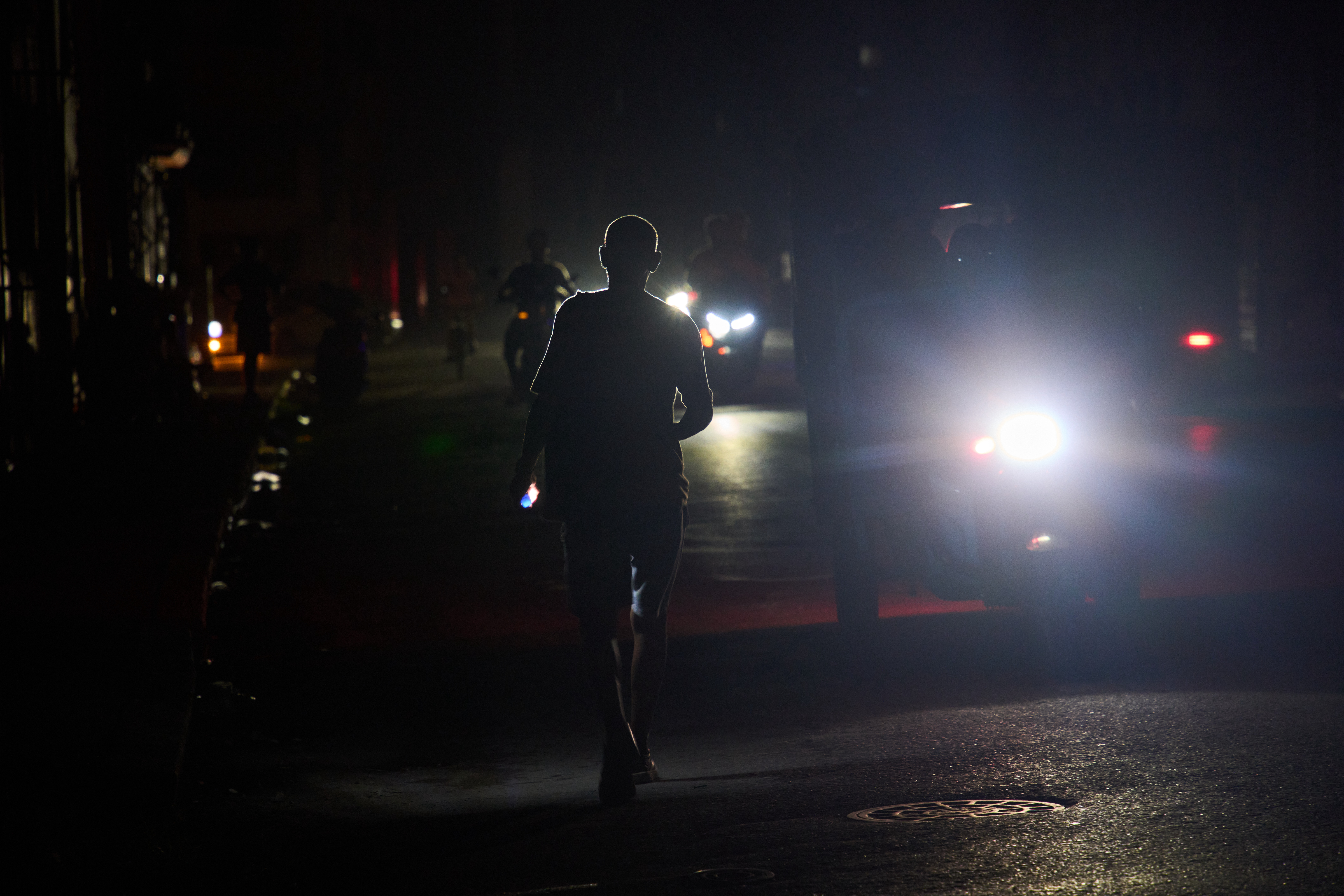 A man walks in the dark during a blackout in Havana, Cuba, Friday, Sept. 18, 2026. (AP Photo/Ramon Espinosa)