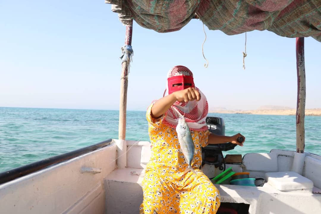 Khadijeh, on her fishing boat during a day of fishing