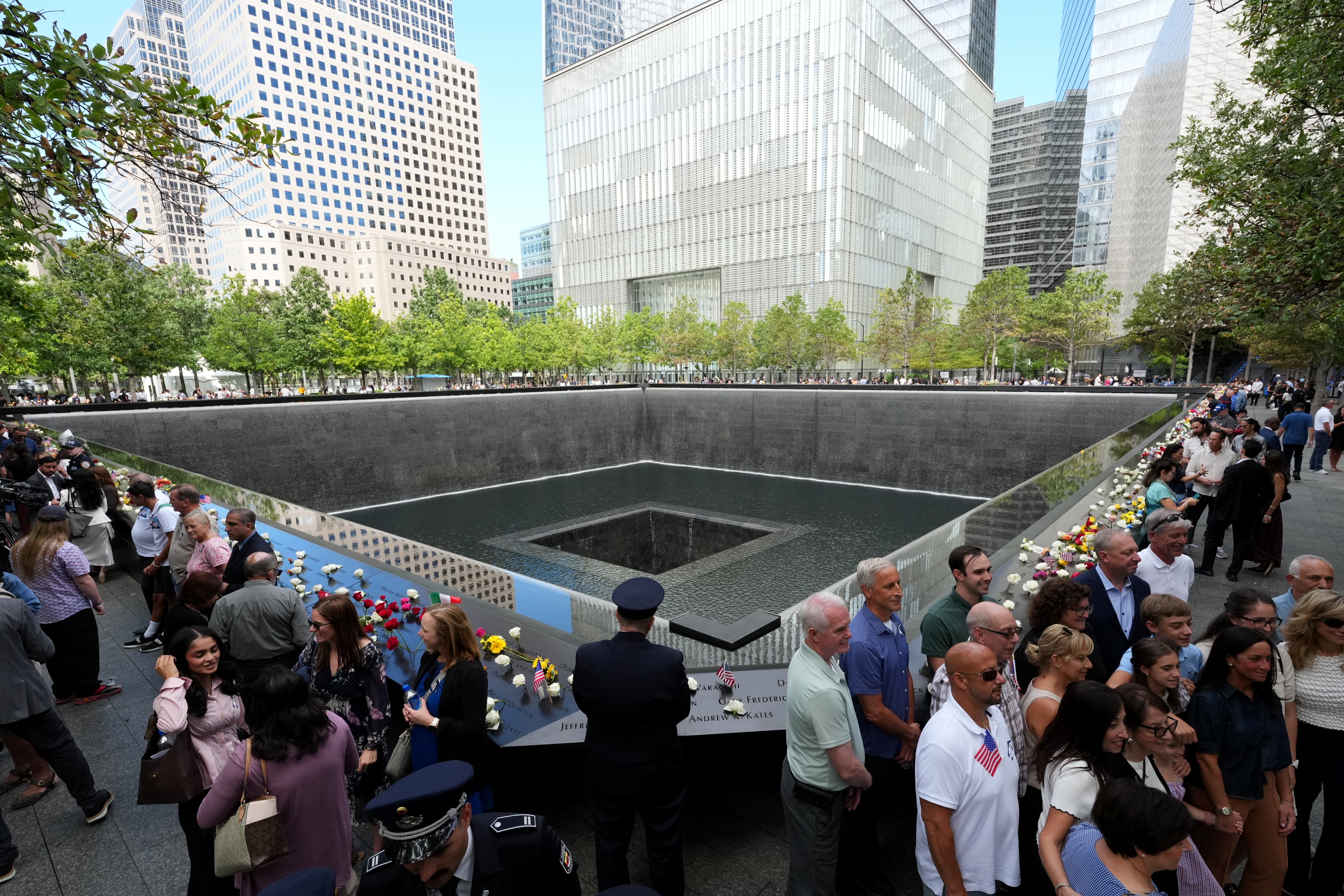 epa13232279 People stand by one of the reflecting pools at the 9/11 Memorial on the 25th anniversary of the September 11 terrorist attacks on the World Trade Center, in New York City, New York, USA, 11 September 2026. Annual commemorative ceremonies are held at the three main sites of the terror attacks on 11 September 2001. EPA/ADAM GRAY / POOL