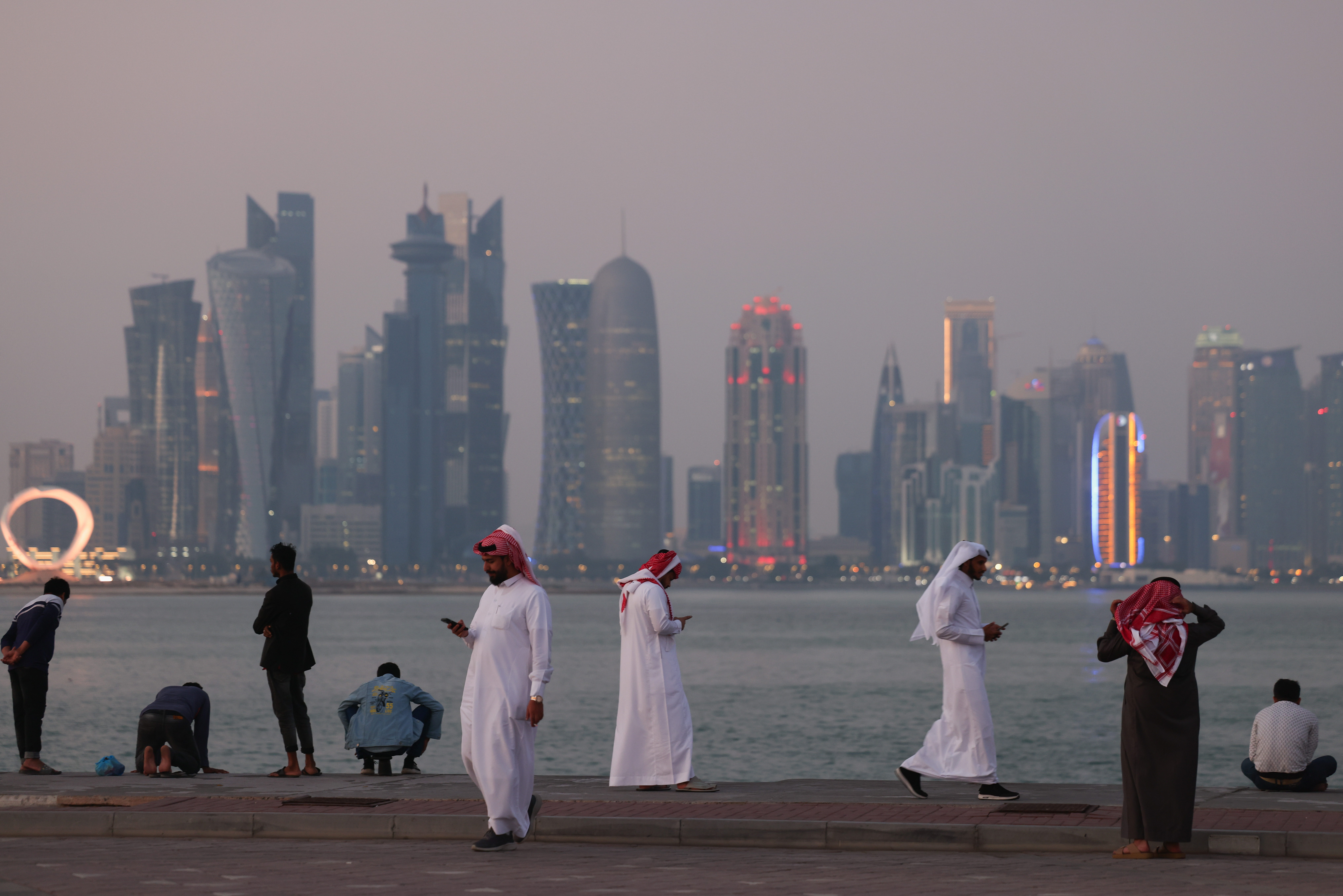 People gather at the Corniche promenade in Doha, Qatar
