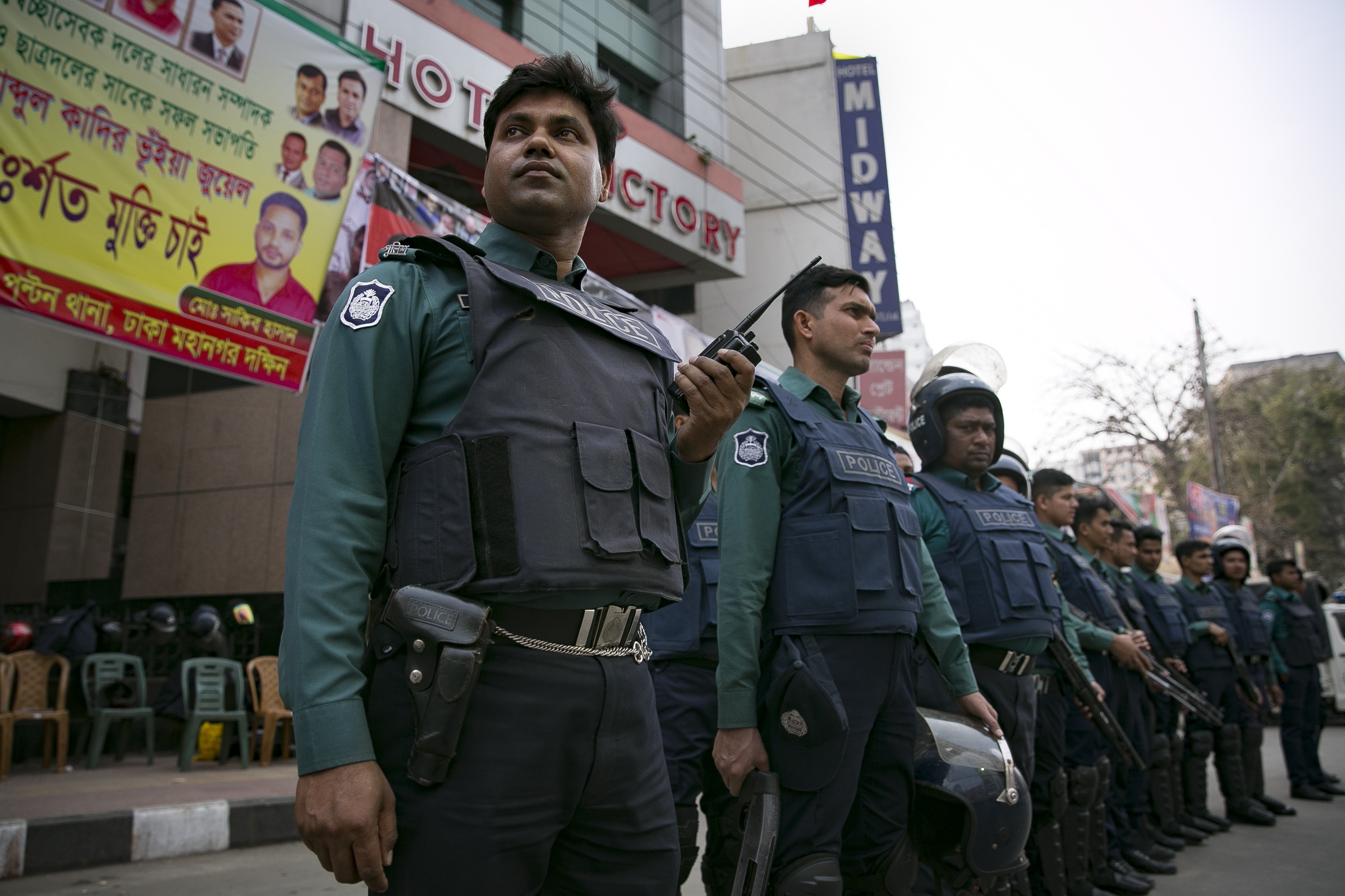 DHAKA, BANGLADESH - FEBRUARY 9: Police stand outside BNP headquarters on February 9, 2018 in Dhaka, Bangladesh. Bangladesh former Prime Minister Khaleda Zia was sentenced on Thursday to five years in prison on corruption charges as police clashed with thousands of her supporters outside the court. Police in Dhaka used tear gas to disperse thousands of her supporters as clashes happened between security forces and opposition protesters before the verdict was read out. (Photo by Allison Joyce/Getty Images)
