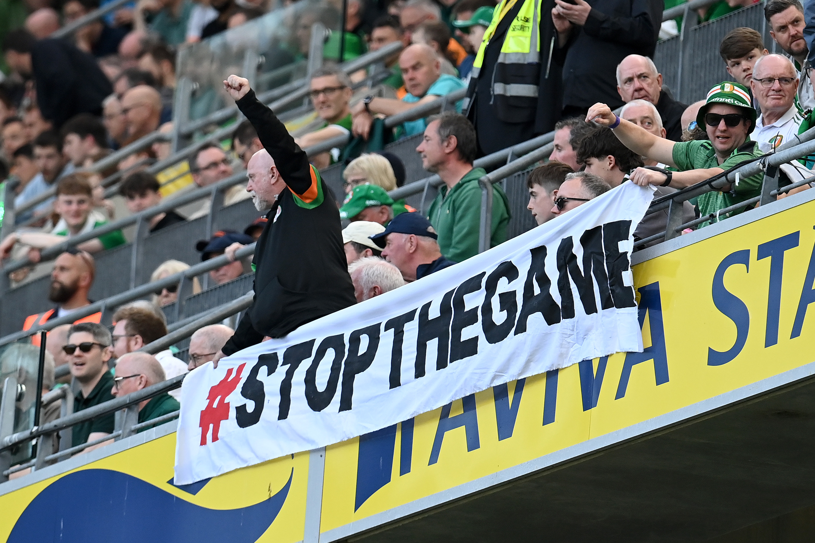 DUBLIN, IRELAND - MAY 28: Fans protest an upcoming match between Republic of Ireland and Israel during the international friendly match between Republic of Ireland and Qatar at Aviva Stadium on May 28, 2026 in Dublin, Ireland. (Photo by Charles McQuillan/Getty Images)