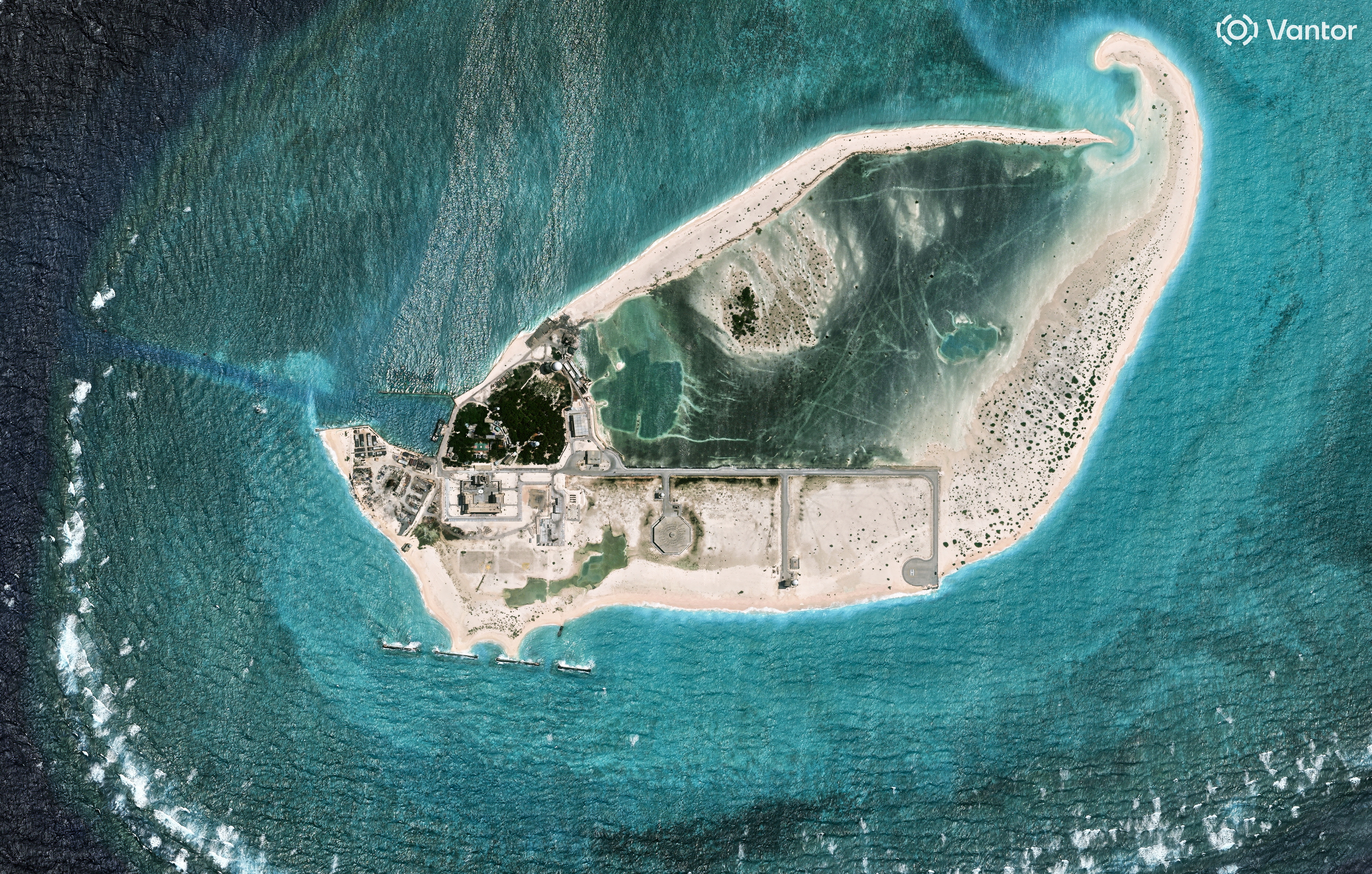 A satellite view of an island in a sea.