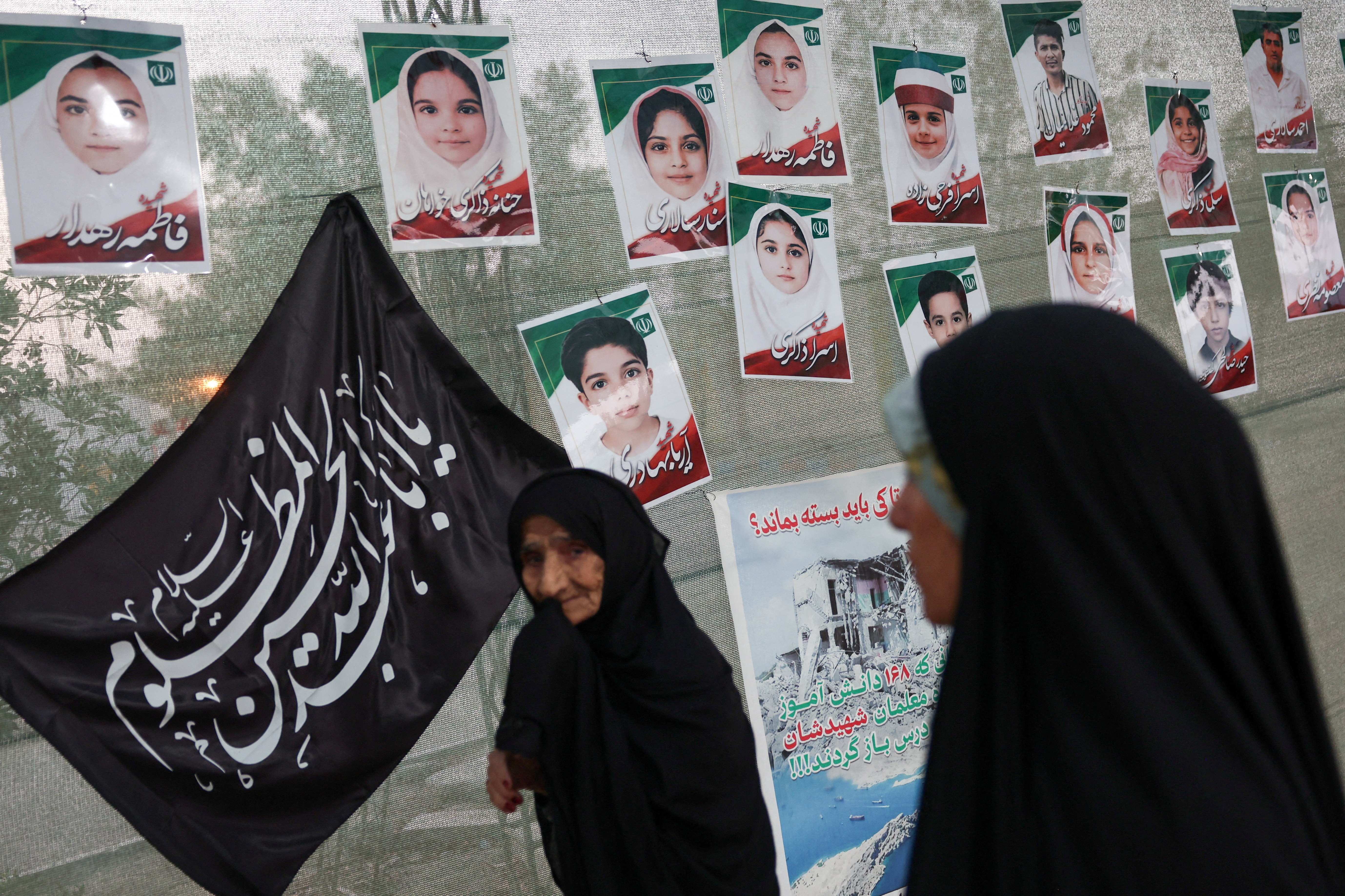 FILE PHOTO: Women in front of images depicting the Minab school students who were killed in a strike on February 28, in Minab, Iran, August 27, 2026. Majid Asgaripour/WANA (West Asia News Agency) via REUTERS ATTENTION EDITORS - THIS PICTURE WAS PROVIDED BY A THIRD PARTY. ISRAEL OUT. NO COMMERCIAL OR EDITORIAL SALES IN ISRAEL. NO ACCESS FOR ISRAELI MEDIA. NO USE BBC PERSIAN. NO USE VOA PERSIAN. NO USE MANOTO. NO USE IRAN INTERNATIONAL. NO USE RADIO FARDA. DIGITAL: NO USE BBC PERSIAN. NO USE VOA PERSIAN. NO USE MANOTO. NO USE IRAN INTERNATIONAL. NO USE RADIO FARDA./File Photo