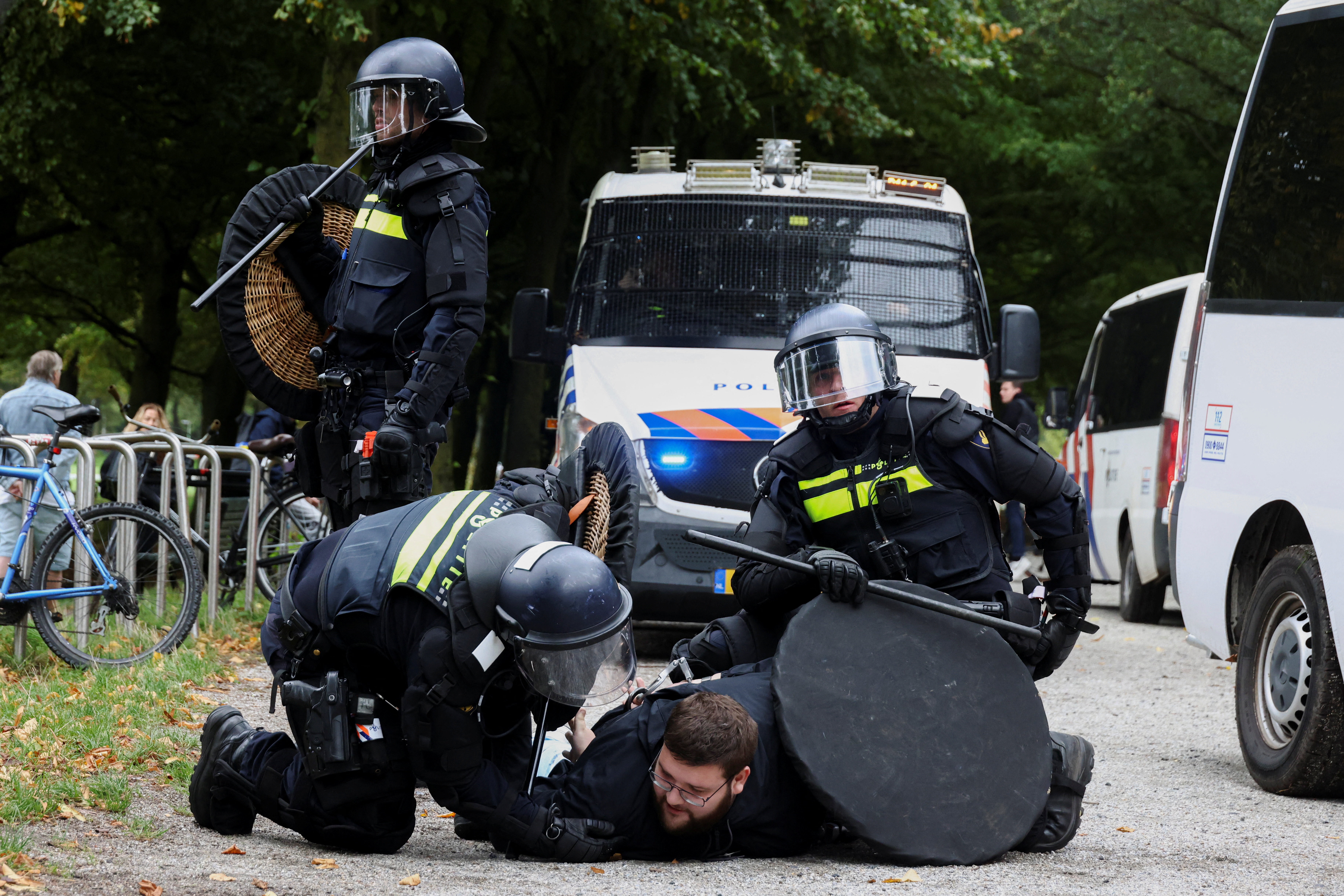 Riot police officers detain a participant of a far-right demonstration in The Hague, Netherlands, September 19, 2026. REUTERS/Nicolas Economou