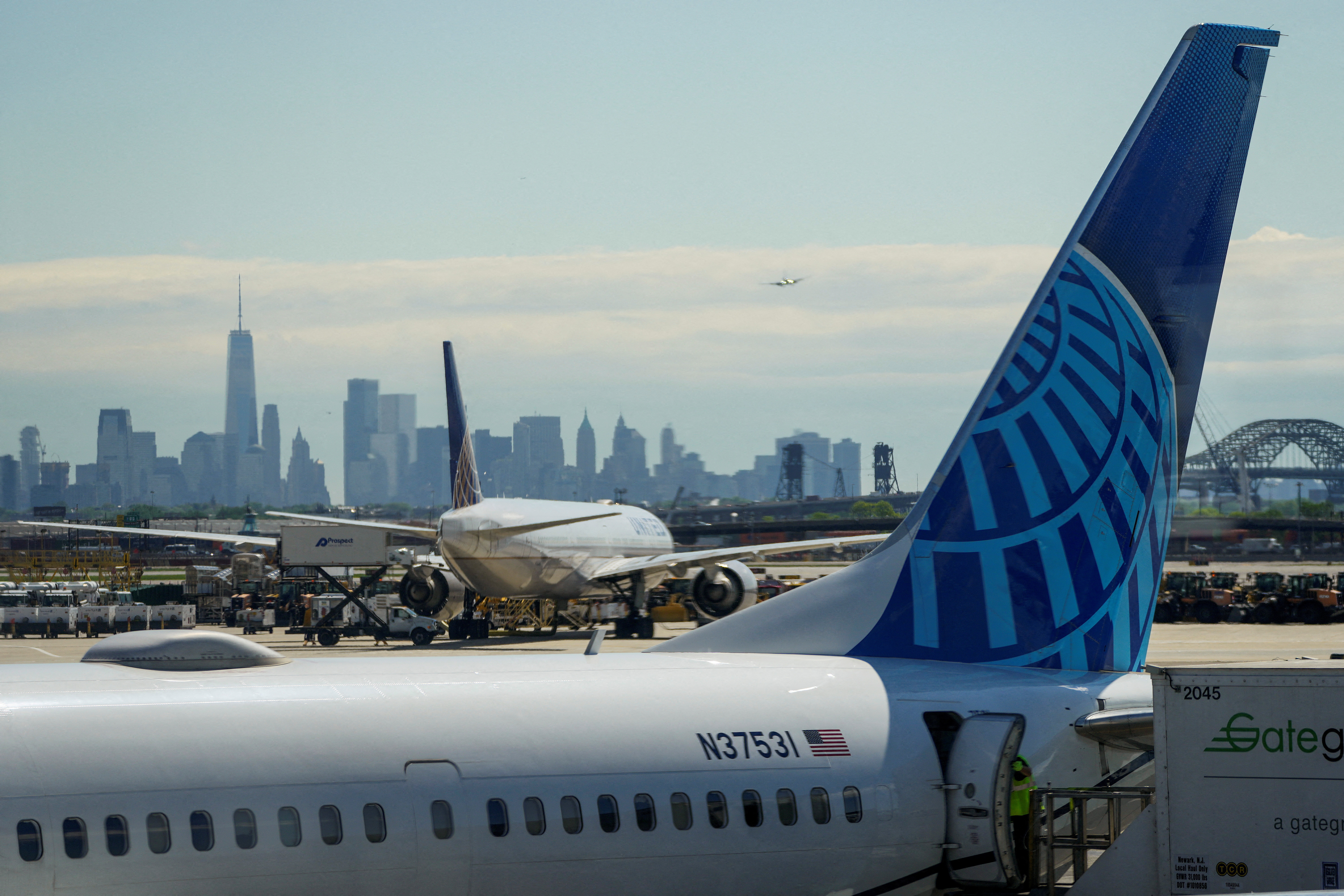 FILE PHOTO: A view shows United Airlines at the tarmac at Newark International Airport, as the skyline of New York is seen in the background from Newark, New Jersey, U.S., May 7, 2025. REUTERS/Eduardo Munoz/File Photo